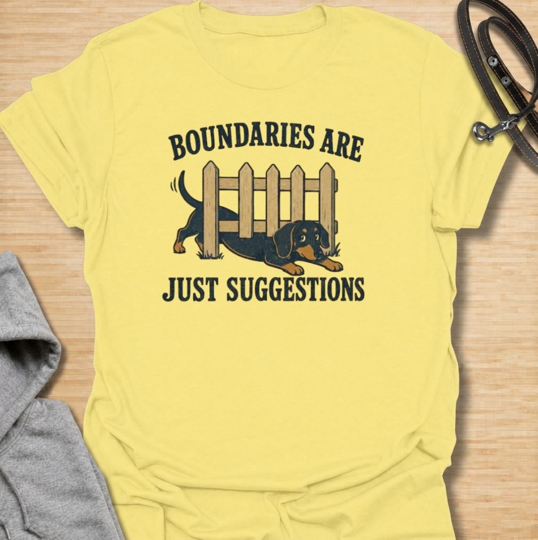 Boundaries are just suggestions when you live with a determined dachshund. This funny dachshund T-shirt features a mischievous sausage dog squeezing beneath a fence, perfectly capturing the breed’s stubborn, curious nature. A fun gift for dachshund moms, dads, and doxie lovers.
