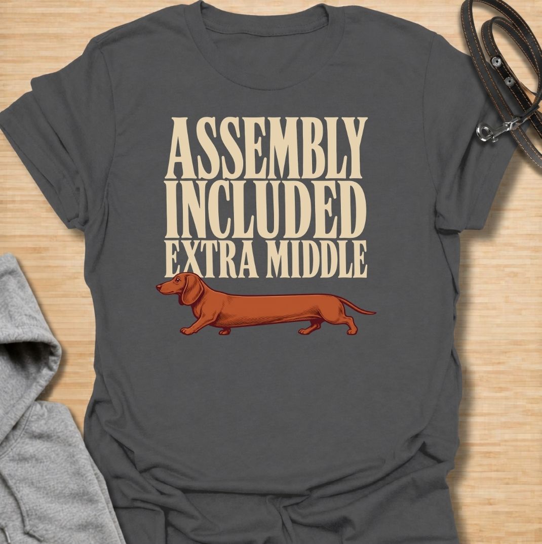 A funny dachshund T-shirt for anyone who knows these little dogs seem to have been built with a little too much middle. Featuring the phrase “Assembly Included Extra Middle” with a long dachshund illustration, this design turns the breed’s unmistakable shape into a dry, clever joke. Perfect for dachshund moms, dachshund dads, sausage dog owners, and anyone who loves breed-specific humor. A playful everyday tee for fans of dachshunds, wiener dogs, and funny dog gifts with a vintage feel.