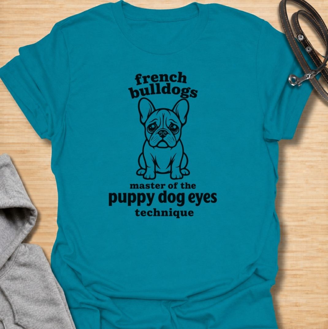 A funny French Bulldog T-shirt for anyone who knows those big eyes can get away with almost anything. Featuring the phrase “French Bulldogs — Master of the Puppy Dog Eyes Technique” with a cute Frenchie illustration, this design celebrates one of the breed’s most persuasive talents. Perfect for Frenchie moms, Frenchie dads, bulldog lovers, and anyone who regularly gives in to that irresistible stare. A playful everyday tee for fans of French Bulldog humor, cute dog sayings, and breed-specific gifts.