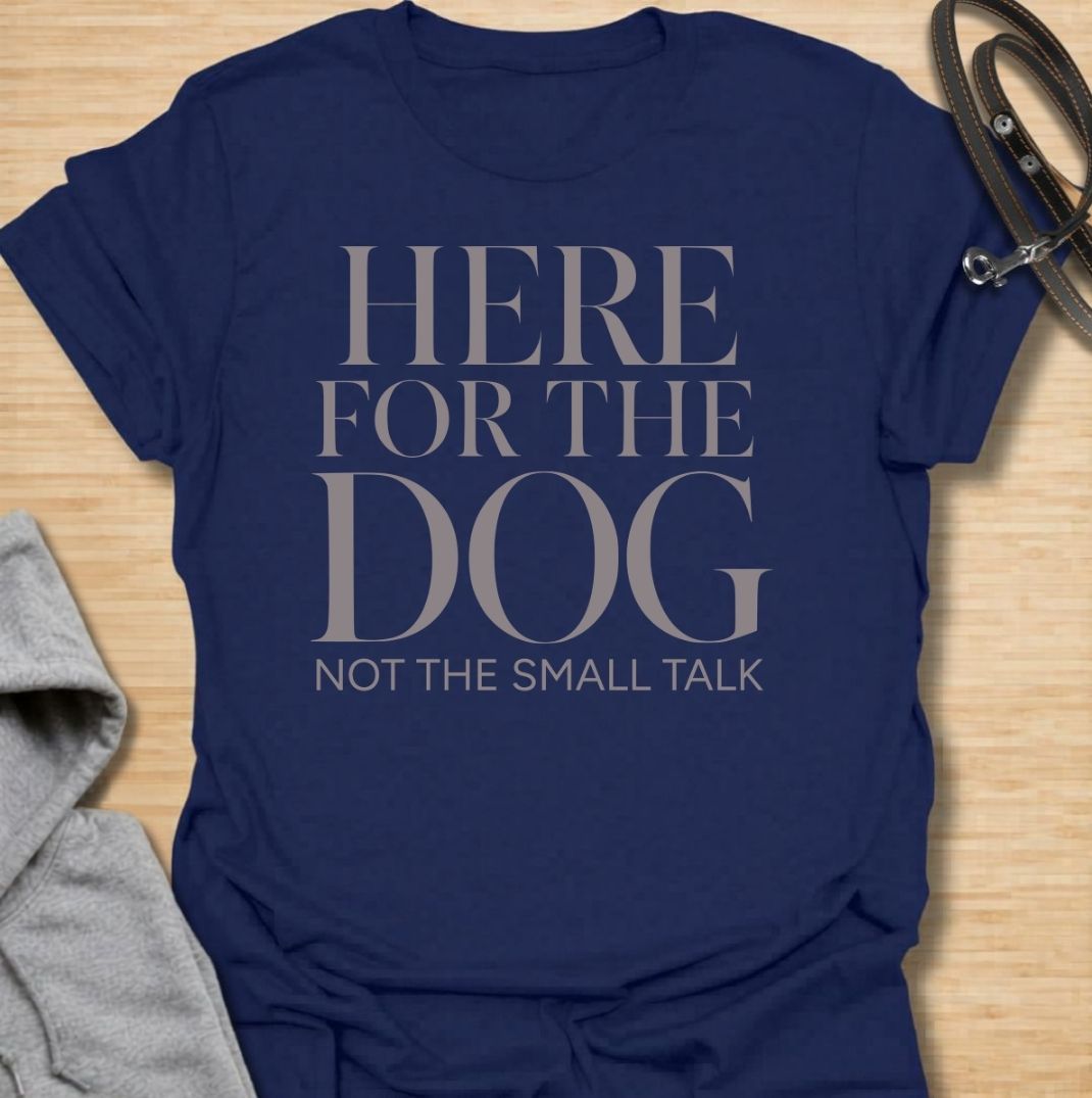 A funny dog T-shirt for anyone who would rather meet the dog than make small talk. Featuring the phrase “Here for the Dog, Not the Small Talk,” this clean text-based design speaks directly to introverted dog lovers and anyone who prefers four-legged company. Perfect for dog moms, dog dads, rescue dog owners, and anyone who heads straight for the dog at every gathering. A simple everyday tee for fans of dry dog humor, pet parent sayings, and general dog lover gifts.