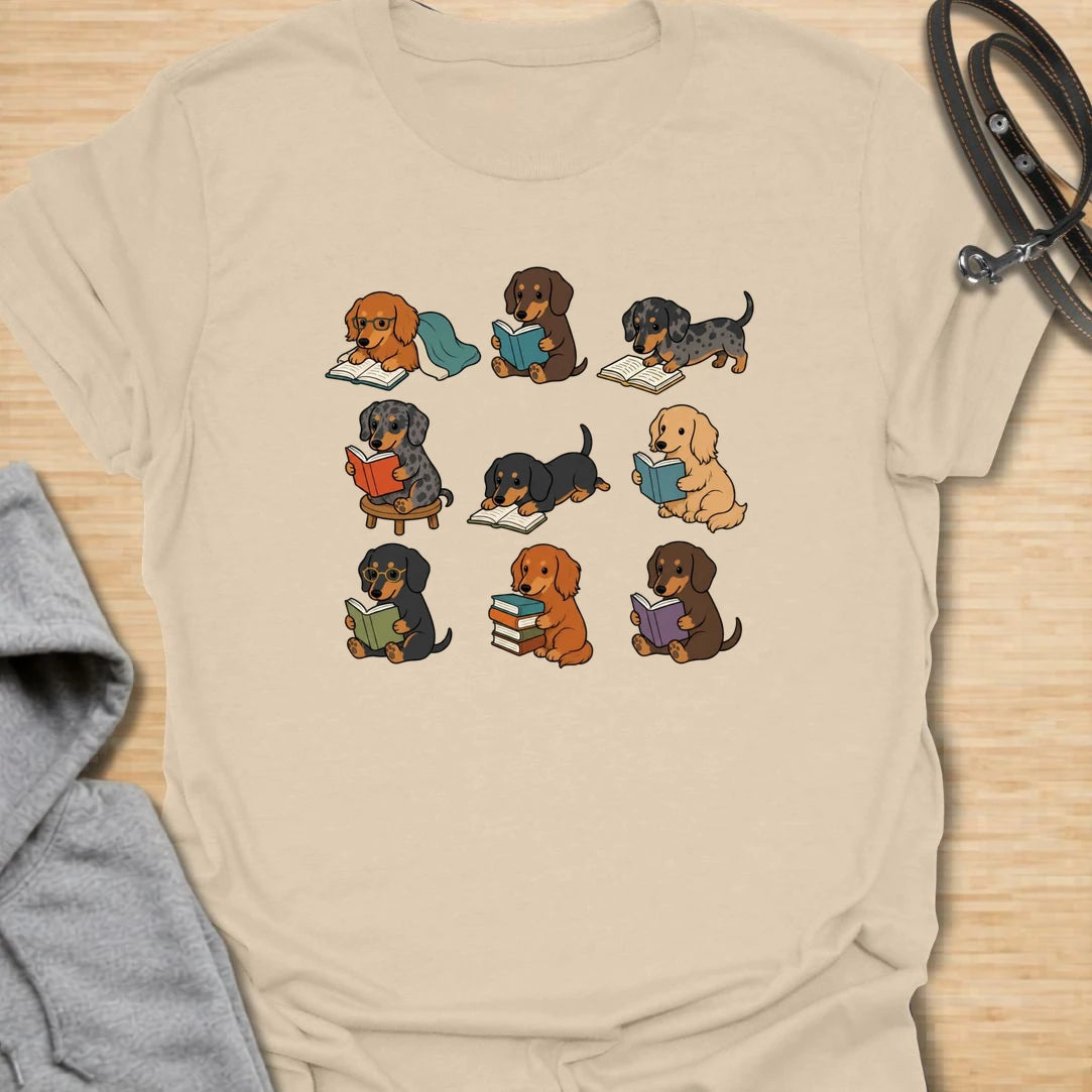 Dachshund Book Club t-shirt for readers who love books almost as much as they love doxies. This sweet design features a group of adorable dachshunds enjoying their books in a cute, cozy book club style. A lovely gift for dachshund moms, dachshund dads, book lovers, teachers, librarians, readers, and anyone who loves sausage dogs. Perfect for casual wear, bookshops, library days, dog walks, reading groups, or cozy weekends.