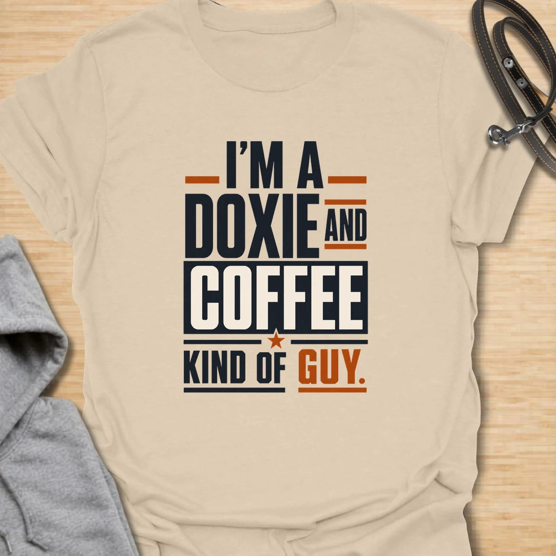 Funny doxie and coffee t-shirt for guys who love dachshunds, caffeine, and simple dog dad style. This bold typography design is perfect for dachshund dads, coffee lovers, dog owners, and anyone whose day starts better with a cup of coffee and a doxie nearby. Also available in a matching girl version, making it a fun couple shirt set for dog-loving coffee drinkers. Great for casual wear, dog walks, coffee runs, weekends, or gifting to a dachshund lover.