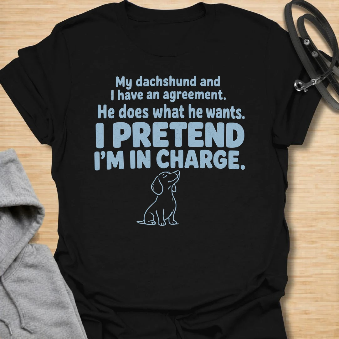 This I Pretend I’m In Charge t-shirt is made for dachshund lovers who know their little long dog makes the rules. Featuring funny text-only styling with a small dachshund line illustration, this design has a relatable dog-parent feel that doxie owners will instantly understand. Perfect for dachshund moms, dachshund dads, wiener dog fans, rescue dog lovers, and anyone whose dachshund does exactly what they want.