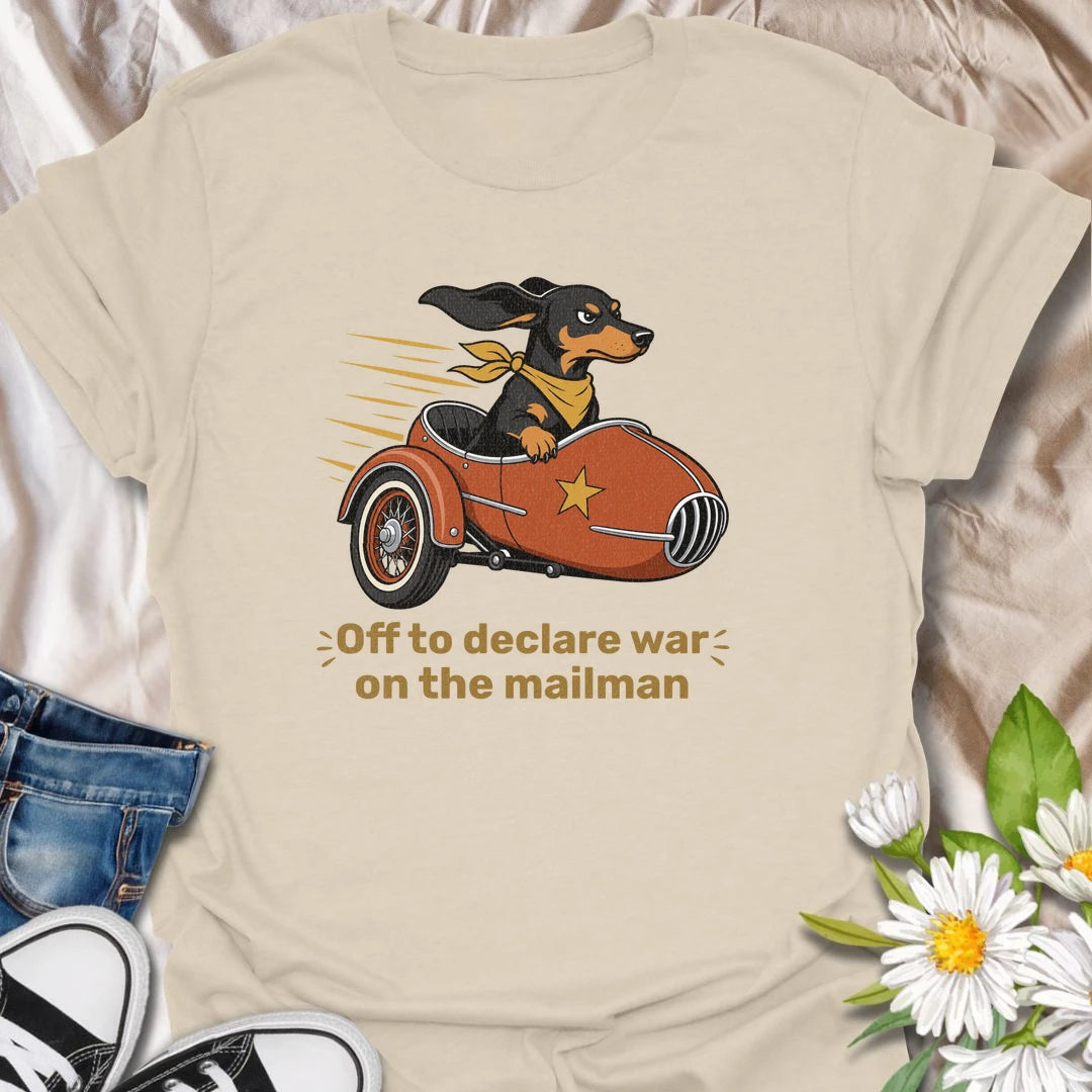 Your dachshund is off to defend the household from its most persistent visitor: the mailman. This funny T-shirt features a determined sausage dog heading into action in a vintage sidecar. A playful gift for dachshund owners familiar with daily barking, window patrol, and dramatic home security.
