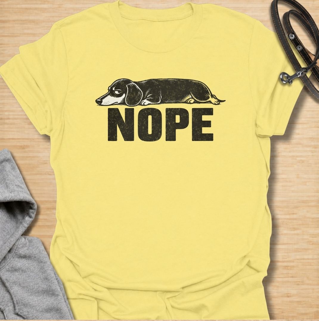 Sometimes the answer is simply nope. This funny dachshund T-shirt features a long, unimpressed sausage dog resting above bold vintage lettering, perfectly capturing the breed’s stubborn and dramatic personality. A simple, highly wearable gift for dachshund owners, doxie lovers, dog moms, and anyone fluent in dachshund attitude.