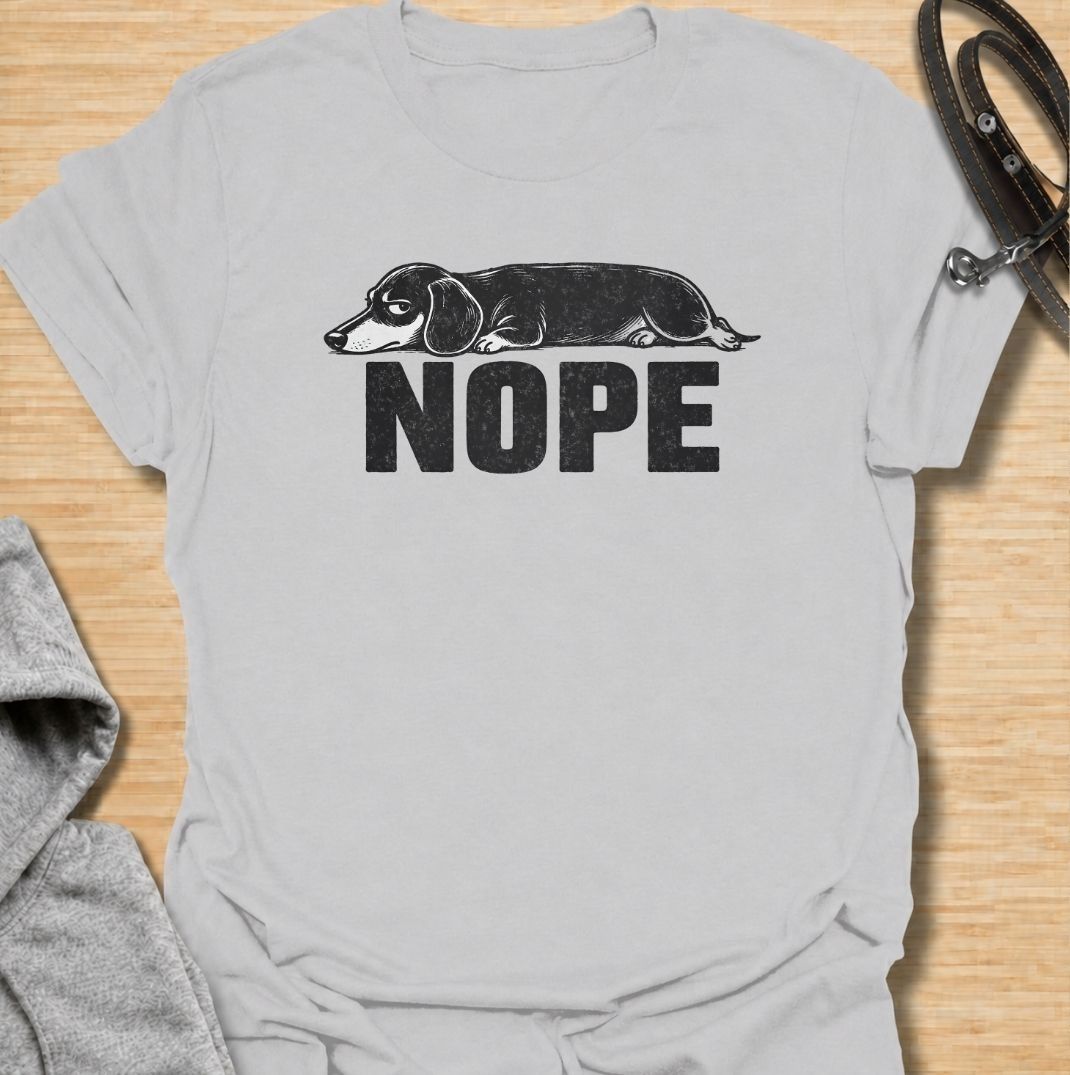 Sometimes the answer is simply nope. This funny dachshund T-shirt features a long, unimpressed sausage dog resting above bold vintage lettering, perfectly capturing the breed’s stubborn and dramatic personality. A simple, highly wearable gift for dachshund owners, doxie lovers, dog moms, and anyone fluent in dachshund attitude.