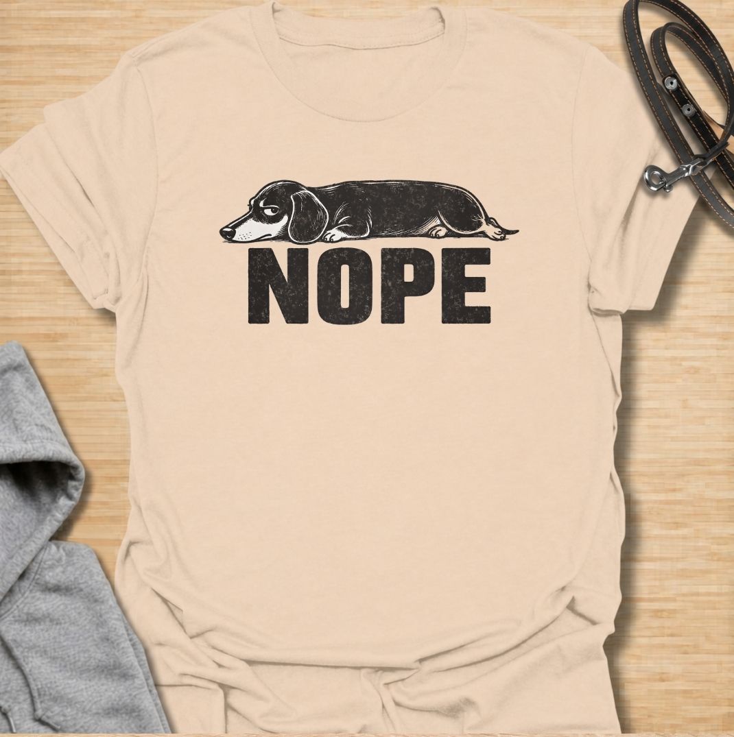 Sometimes the answer is simply nope. This funny dachshund T-shirt features a long, unimpressed sausage dog resting above bold vintage lettering, perfectly capturing the breed’s stubborn and dramatic personality. A simple, highly wearable gift for dachshund owners, doxie lovers, dog moms, and anyone fluent in dachshund attitude.