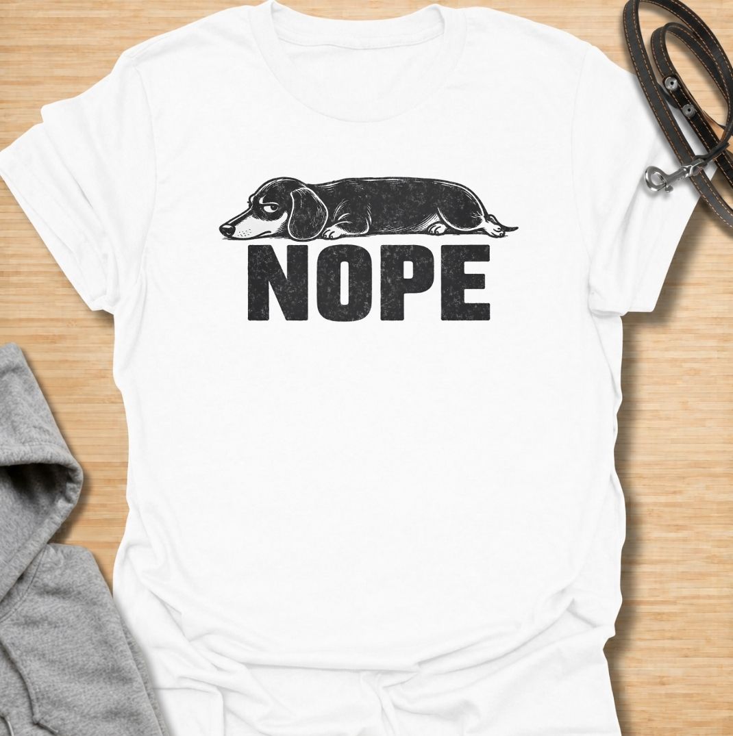 Sometimes the answer is simply nope. This funny dachshund T-shirt features a long, unimpressed sausage dog resting above bold vintage lettering, perfectly capturing the breed’s stubborn and dramatic personality. A simple, highly wearable gift for dachshund owners, doxie lovers, dog moms, and anyone fluent in dachshund attitude.
