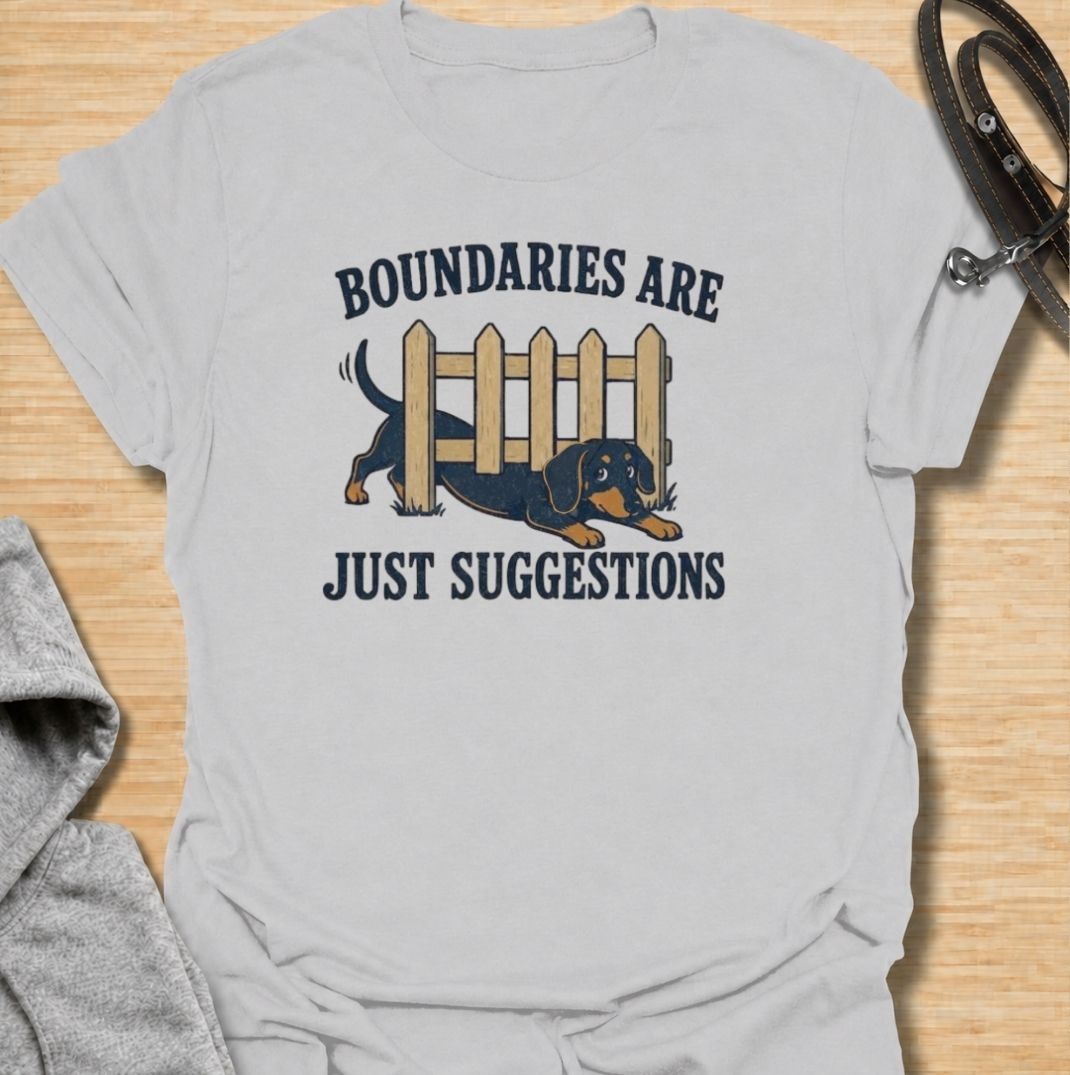 Boundaries are just suggestions when you live with a determined dachshund. This funny dachshund T-shirt features a mischievous sausage dog squeezing beneath a fence, perfectly capturing the breed’s stubborn, curious nature. A fun gift for dachshund moms, dads, and doxie lovers.
