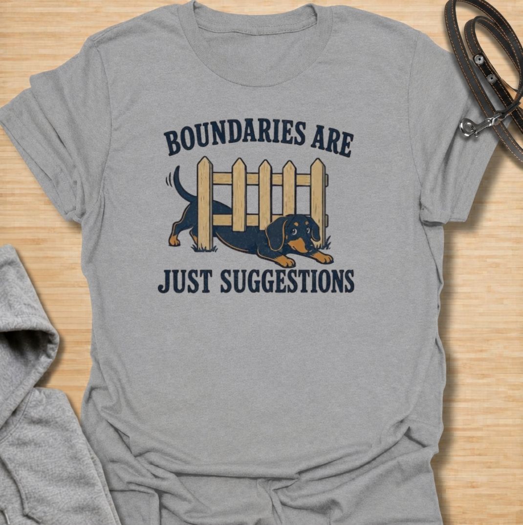 Boundaries are just suggestions when you live with a determined dachshund. This funny dachshund T-shirt features a mischievous sausage dog squeezing beneath a fence, perfectly capturing the breed’s stubborn, curious nature. A fun gift for dachshund moms, dads, and doxie lovers.