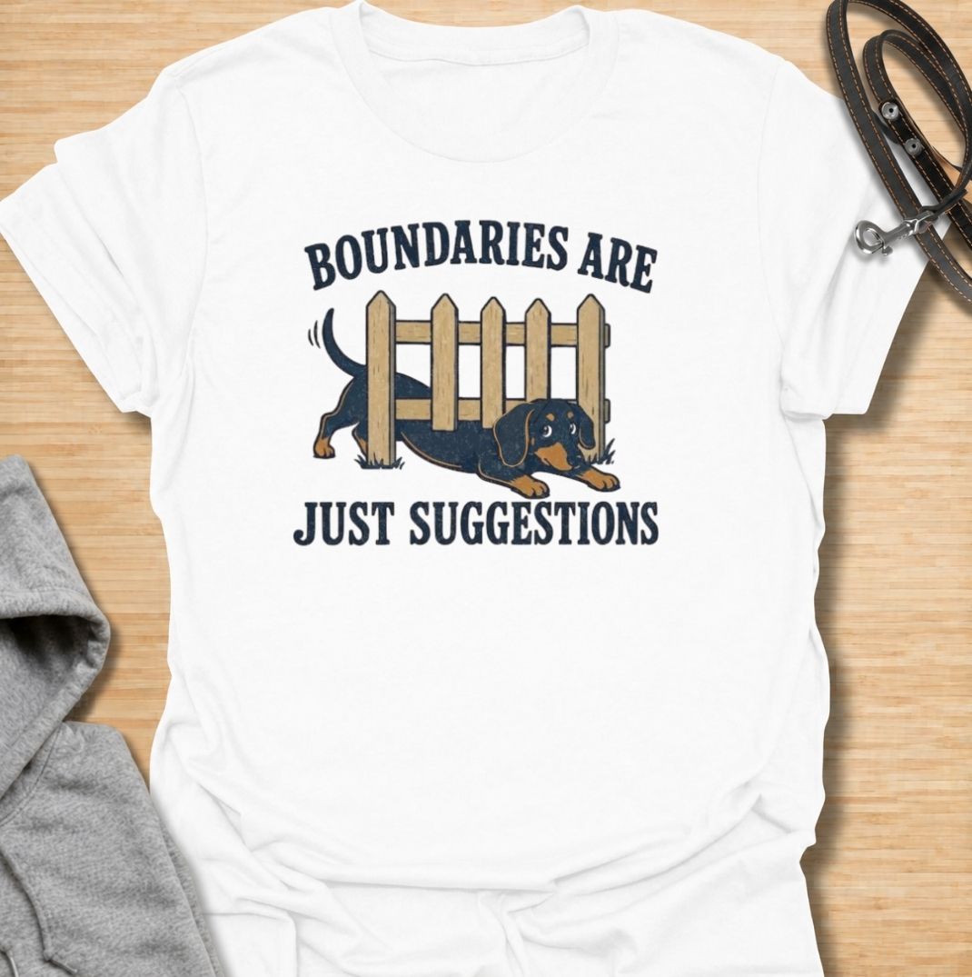 Boundaries are just suggestions when you live with a determined dachshund. This funny dachshund T-shirt features a mischievous sausage dog squeezing beneath a fence, perfectly capturing the breed’s stubborn, curious nature. A fun gift for dachshund moms, dads, and doxie lovers.