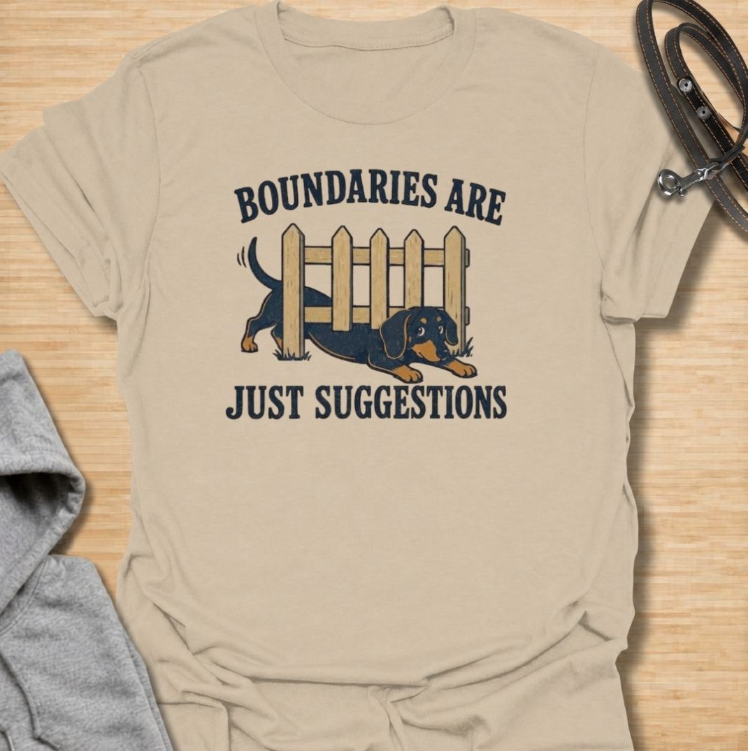 Boundaries are just suggestions when you live with a determined dachshund. This funny dachshund T-shirt features a mischievous sausage dog squeezing beneath a fence, perfectly capturing the breed’s stubborn, curious nature. A fun gift for dachshund moms, dads, and doxie lovers.