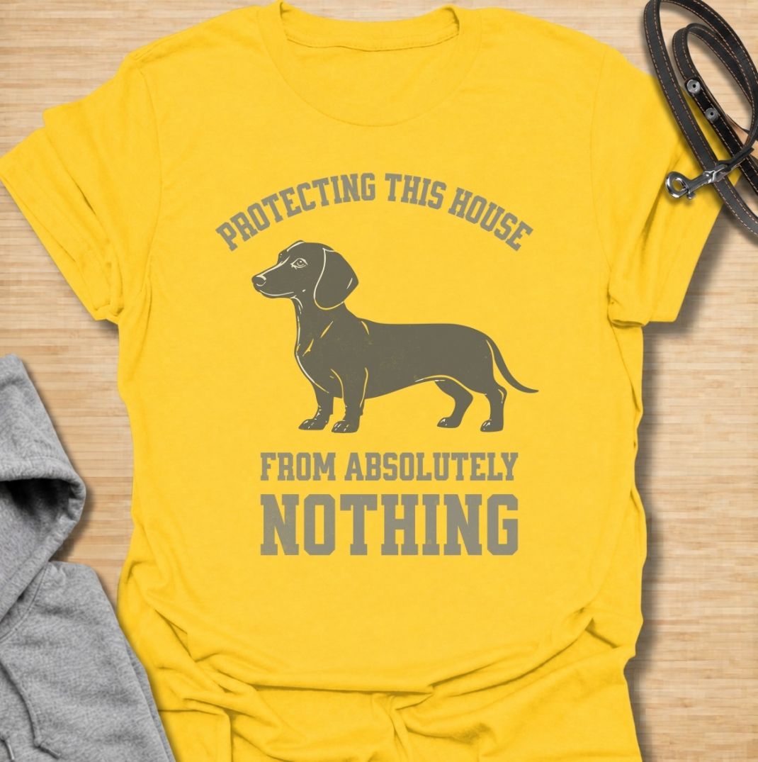 Protecting this house from absolutely nothing. A funny dachshund T-shirt for sausage dog owners who know their little watchdog takes security very seriously.