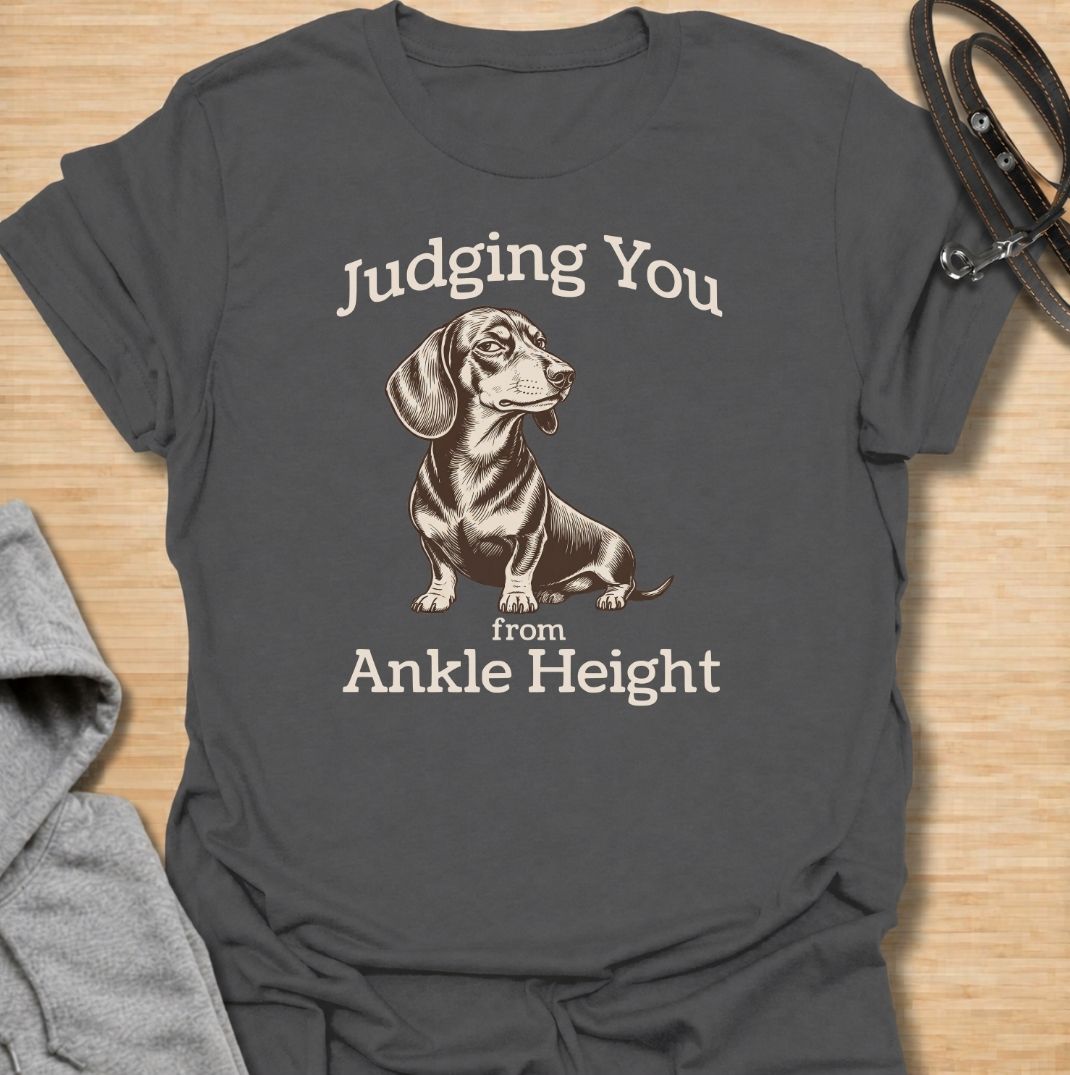 Judging you from ankle height. A funny dachshund T-shirt for sausage dog owners who know those short legs come with very big opinions.