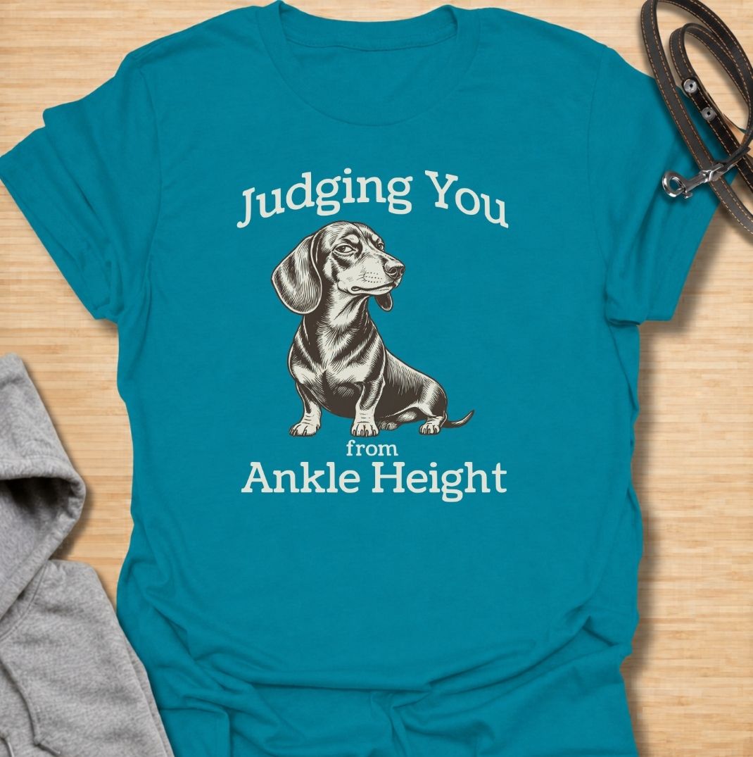 Judging you from ankle height. A funny dachshund T-shirt for sausage dog owners who know those short legs come with very big opinions.