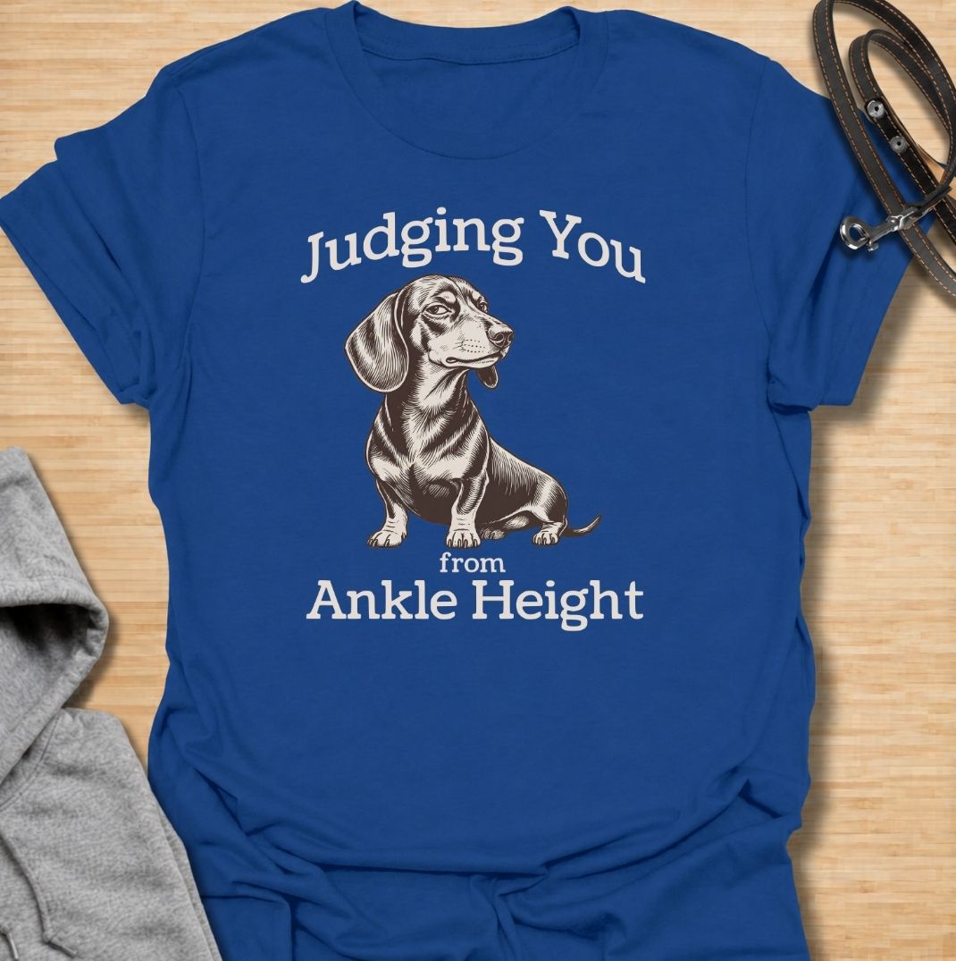 Judging you from ankle height. A funny dachshund T-shirt for sausage dog owners who know those short legs come with very big opinions.