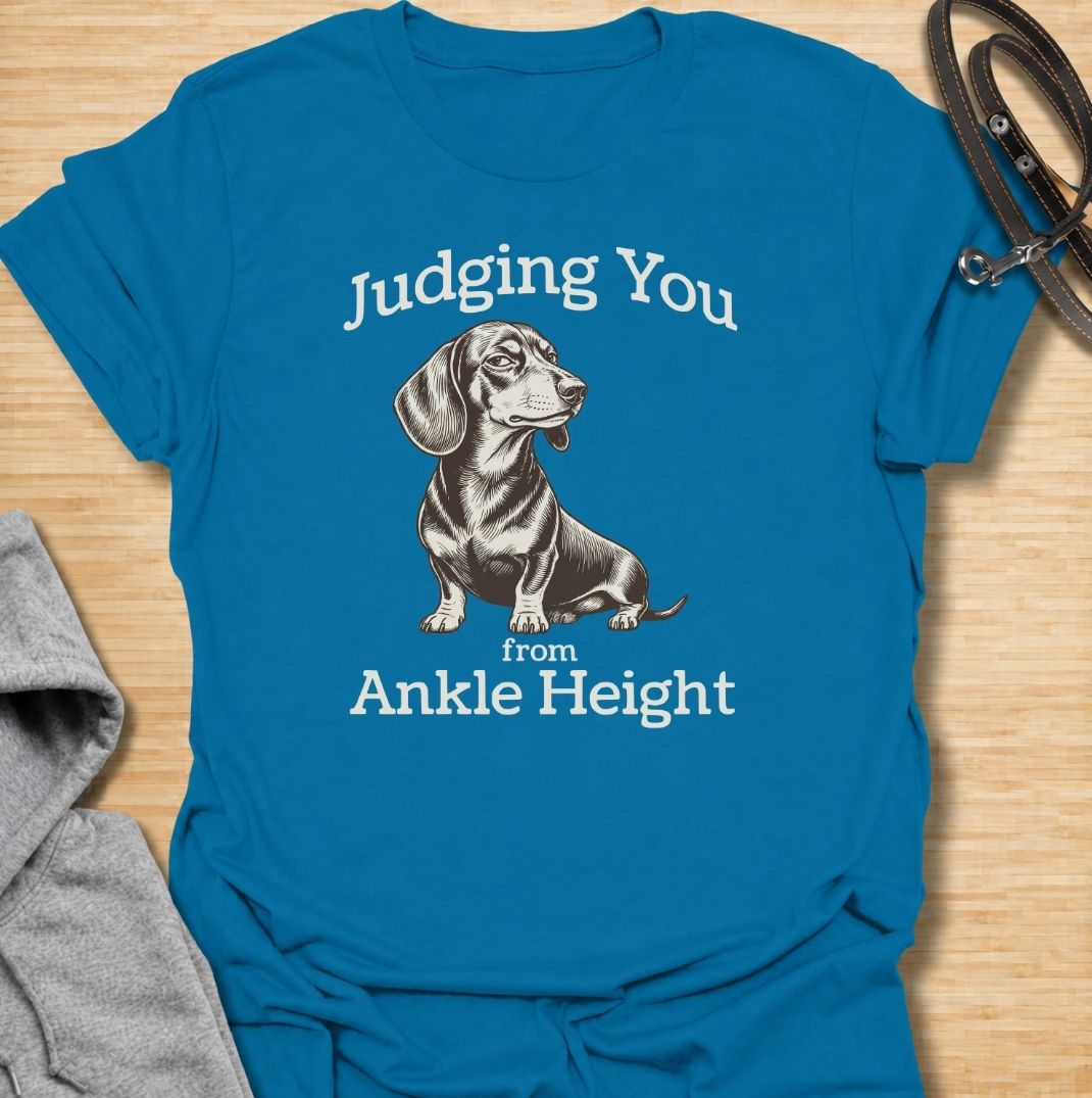 Judging you from ankle height. A funny dachshund T-shirt for sausage dog owners who know those short legs come with very big opinions.