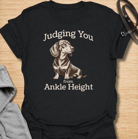 Judging you from ankle height. A funny dachshund T-shirt for sausage dog owners who know those short legs come with very big opinions.