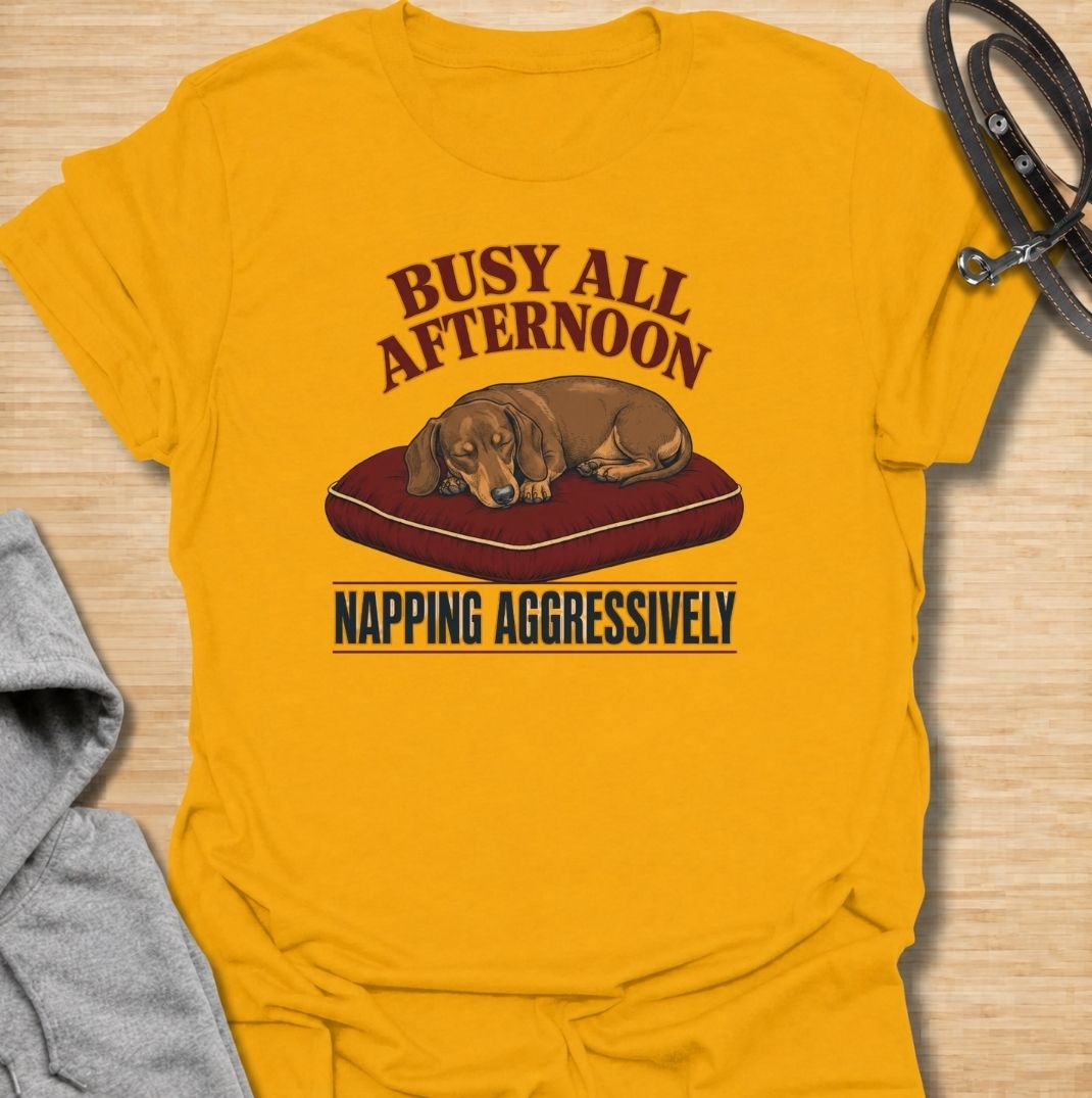 For dachshund owners who know that napping is serious business.
This funny dachshund T-shirt features a sleepy sausage dog with the phrase “Busy All Afternoon – Napping Aggressively.”
A great choice for dog lovers who appreciate lazy afternoons, dry humor, and classic dachshund attitude.
Perfect for everyday wear, weekends, lounging, or gifting to the dachshund-obsessed.
A fun dog lover tee with vintage-inspired style and plenty of personality.