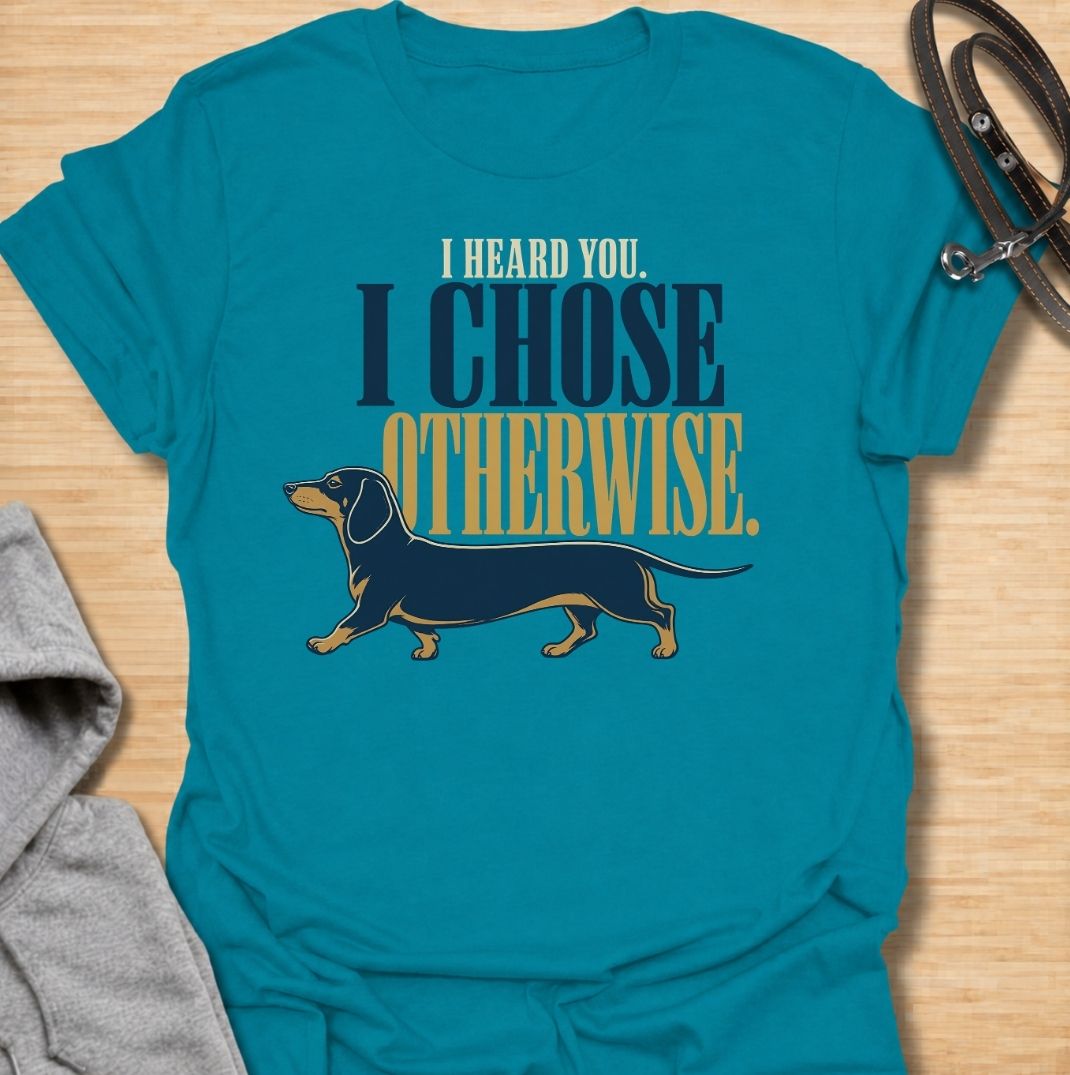For dachshund owners who know their dog heard every word and simply made a different decision. This funny dachshund T-shirt features the phrase “I Heard You. I Chose Otherwise.” with a bold vintage-style doxie illustration. Perfect for anyone living with an independent, stubborn and wonderfully opinionated sausage dog. A fun dog lover tee that captures classic dachshund attitude perfectly.