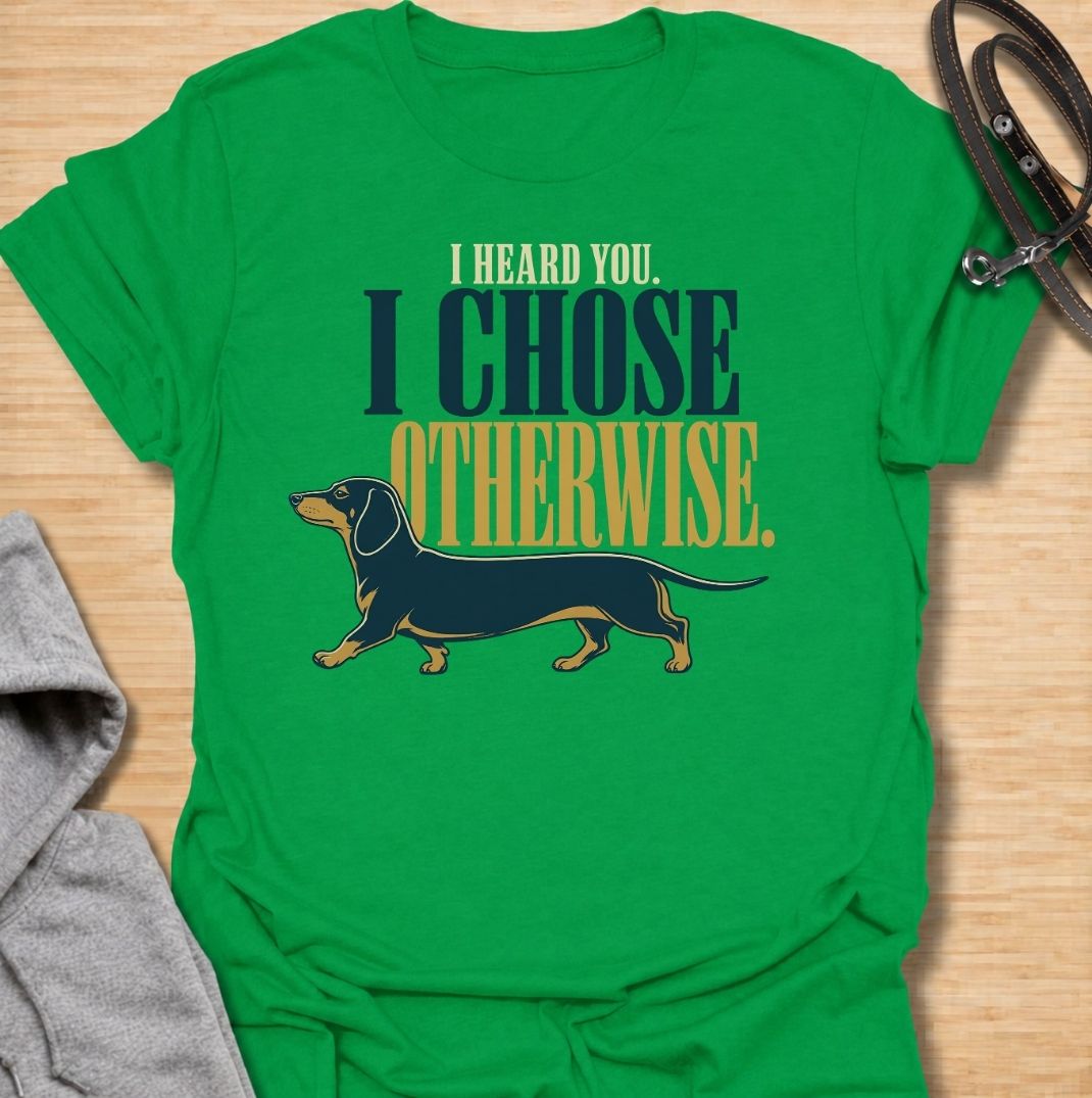 For dachshund owners who know their dog heard every word and simply made a different decision. This funny dachshund T-shirt features the phrase “I Heard You. I Chose Otherwise.” with a bold vintage-style doxie illustration. Perfect for anyone living with an independent, stubborn and wonderfully opinionated sausage dog. A fun dog lover tee that captures classic dachshund attitude perfectly.