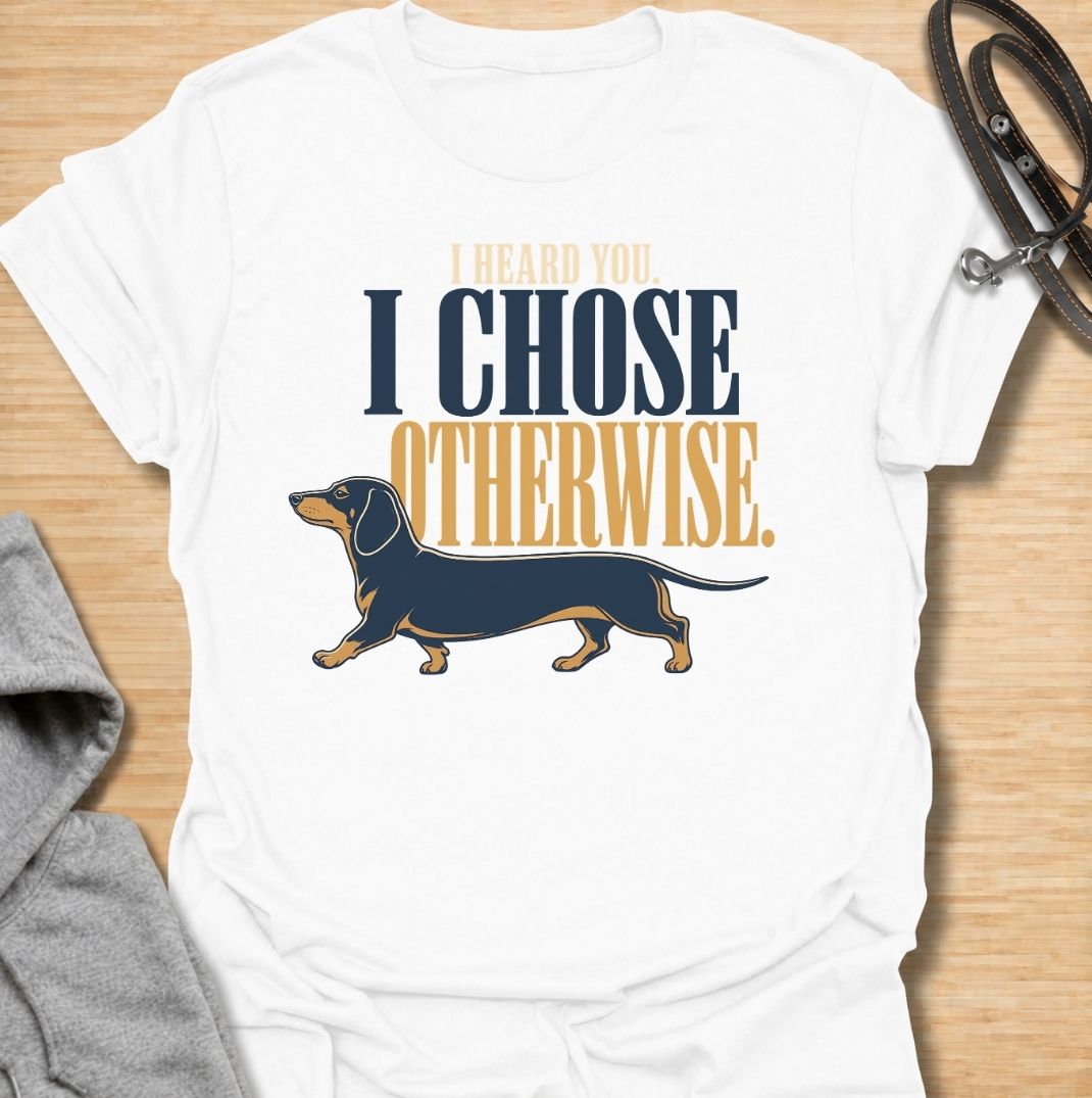 For dachshund owners who know their dog heard every word and simply made a different decision. This funny dachshund T-shirt features the phrase “I Heard You. I Chose Otherwise.” with a bold vintage-style doxie illustration. Perfect for anyone living with an independent, stubborn and wonderfully opinionated sausage dog. A fun dog lover tee that captures classic dachshund attitude perfectly.