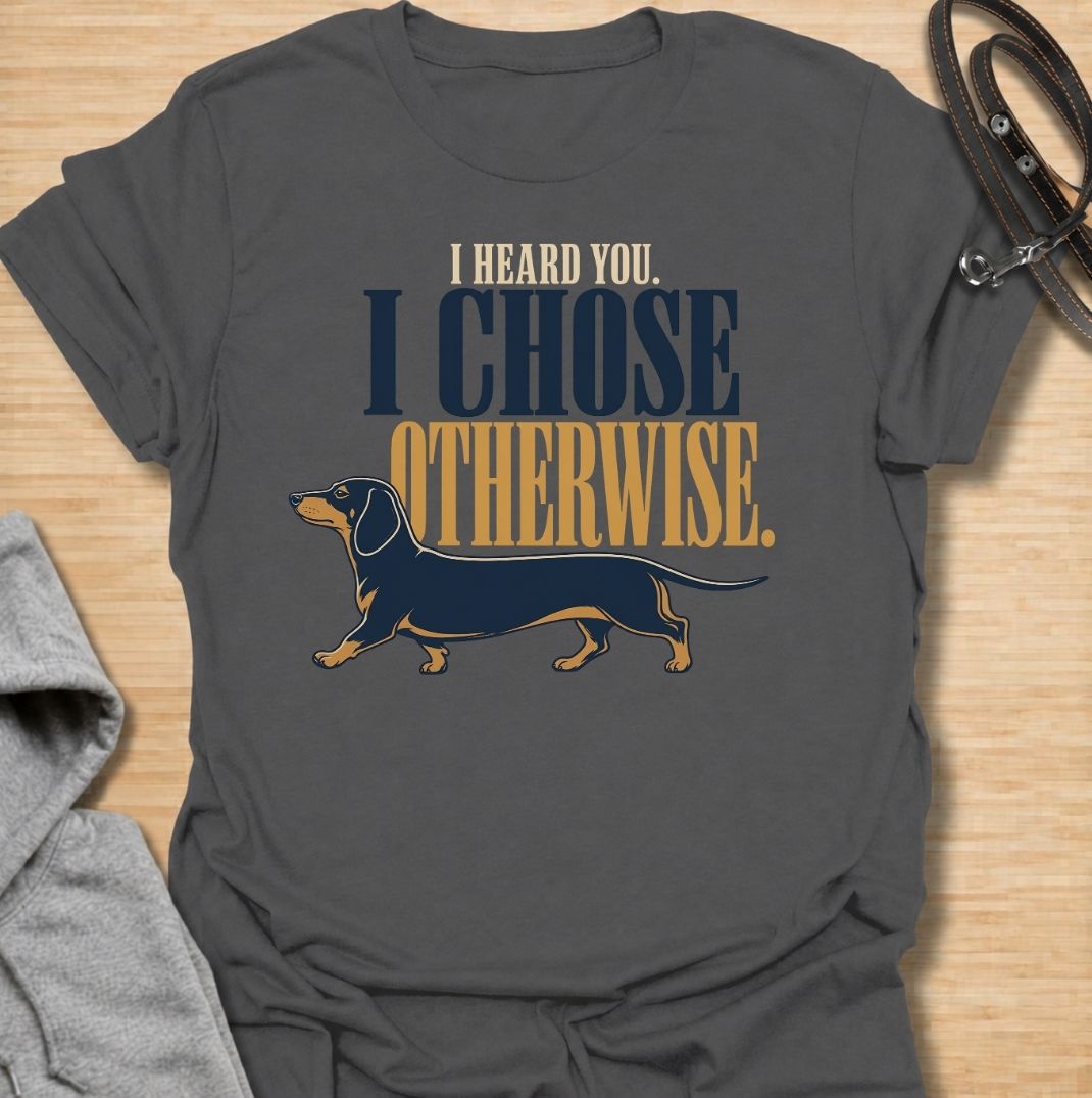 For dachshund owners who know their dog heard every word and simply made a different decision. This funny dachshund T-shirt features the phrase “I Heard You. I Chose Otherwise.” with a bold vintage-style doxie illustration. Perfect for anyone living with an independent, stubborn and wonderfully opinionated sausage dog. A fun dog lover tee that captures classic dachshund attitude perfectly.