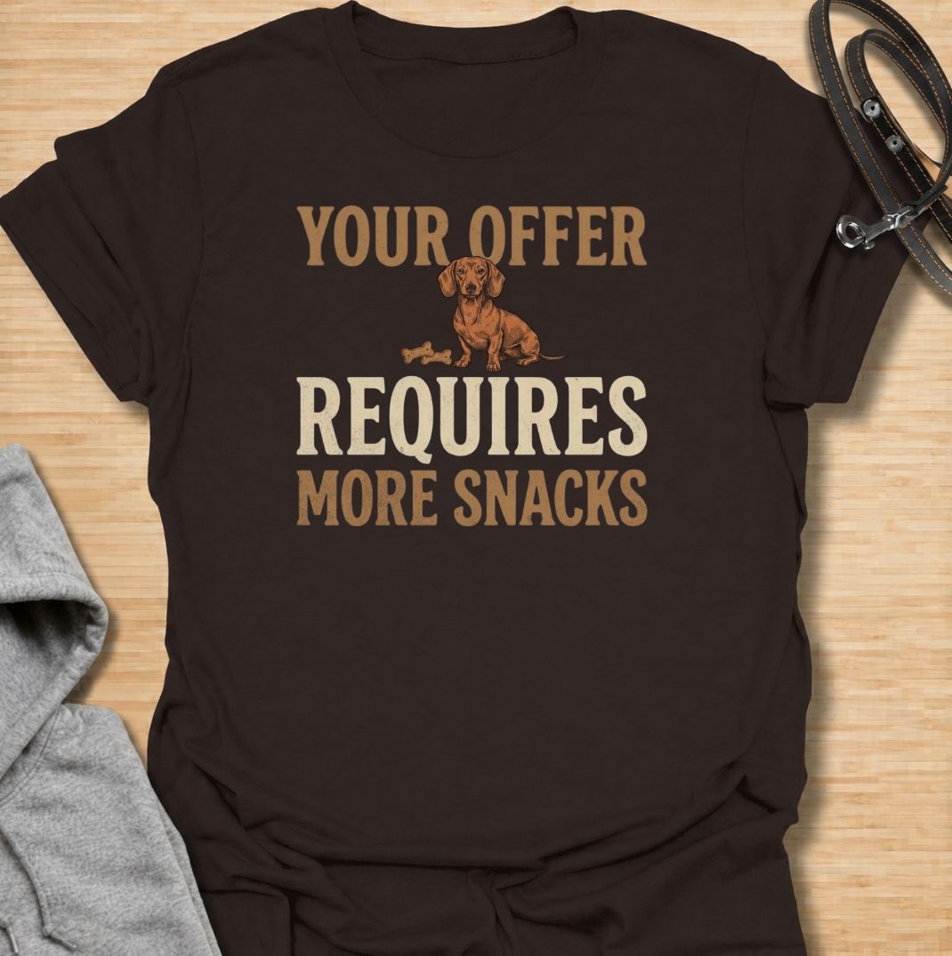For dachshunds who know every offer can be improved with the addition of snacks. This funny dachshund T-shirt features the phrase “Your Offer Requires More Snacks” with a stubborn little doxie at the center. Perfect for dachshund owners who know treats are less of a reward and more of a bargaining tool. A playful dog lover tee packed with classic sausage dog attitude.