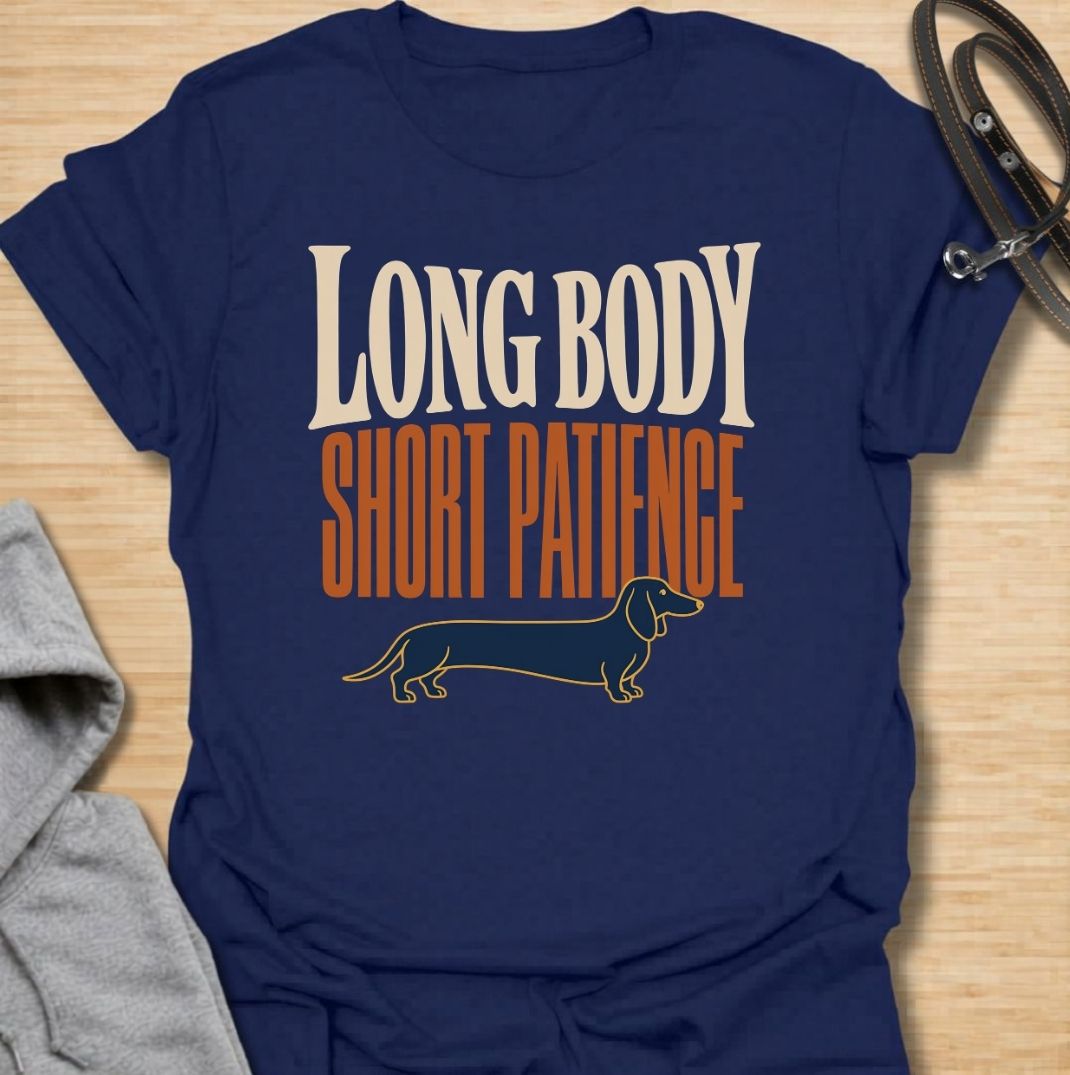 For dachshunds blessed with an impressively long body and a remarkably limited supply of patience. This funny dachshund T-shirt features the phrase “Long Body, Short Patience” with a clean vintage-inspired sausage dog illustration. Perfect for doxie owners who know stubbornness, impatience and plenty of attitude all come with those tiny legs. A bold dog lover tee that captures classic dachshund personality without taking itself too seriously.
