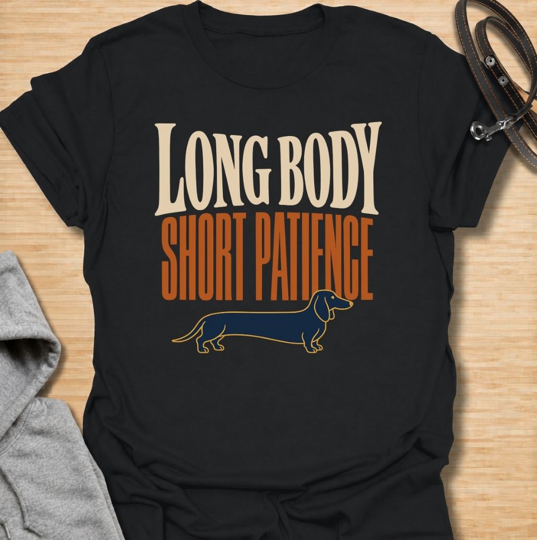 For dachshunds blessed with an impressively long body and a remarkably limited supply of patience. This funny dachshund T-shirt features the phrase “Long Body, Short Patience” with a clean vintage-inspired sausage dog illustration. Perfect for doxie owners who know stubbornness, impatience and plenty of attitude all come with those tiny legs. A bold dog lover tee that captures classic dachshund personality without taking itself too seriously.