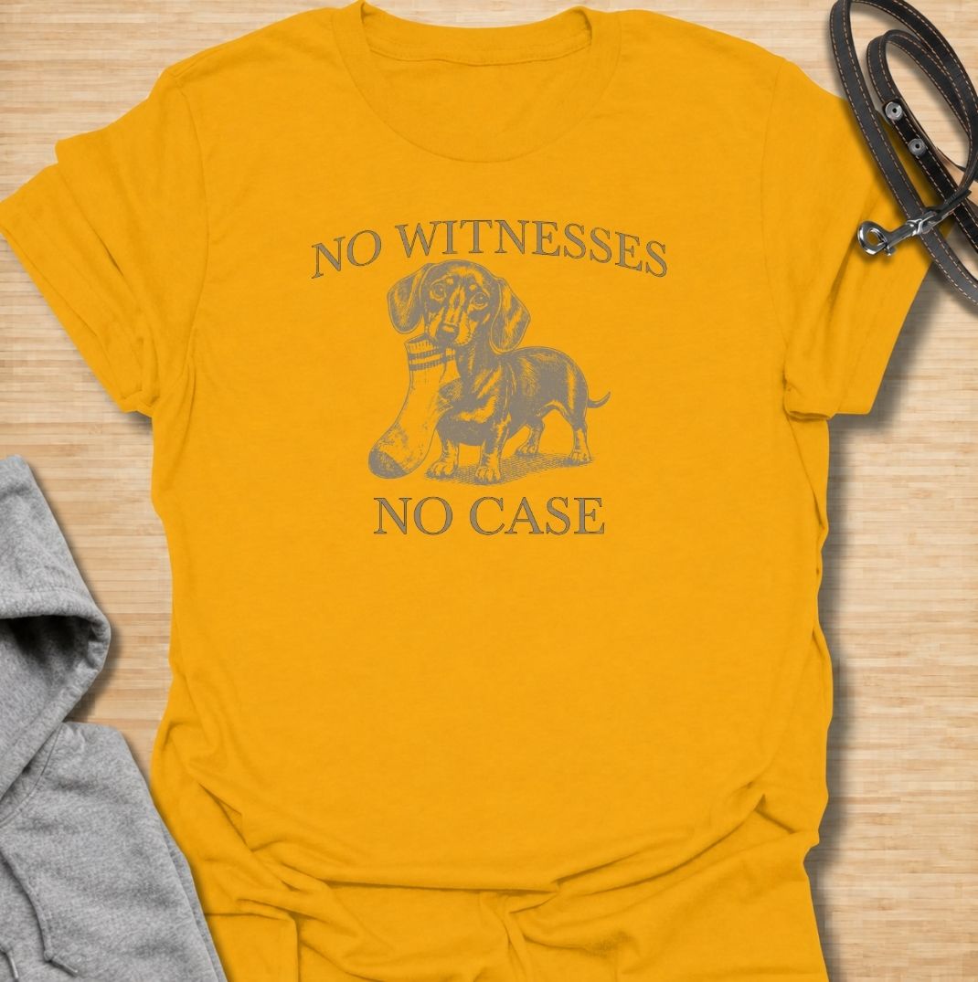 A funny dachshund T-shirt for owners who know their little dog is capable of suspicious behavior. The vintage-style dachshund graphic and “No Witnesses, No Case” phrase give this design a dry, mischievous sense of humor without feeling overly cute. Perfect for dachshund moms, dachshund dads, sausage dog lovers, and anyone familiar with the breed’s stubborn personality. An easy everyday dog lover tee with a retro look that works especially well for fans of funny dachshund shirts and wiener dog humor.