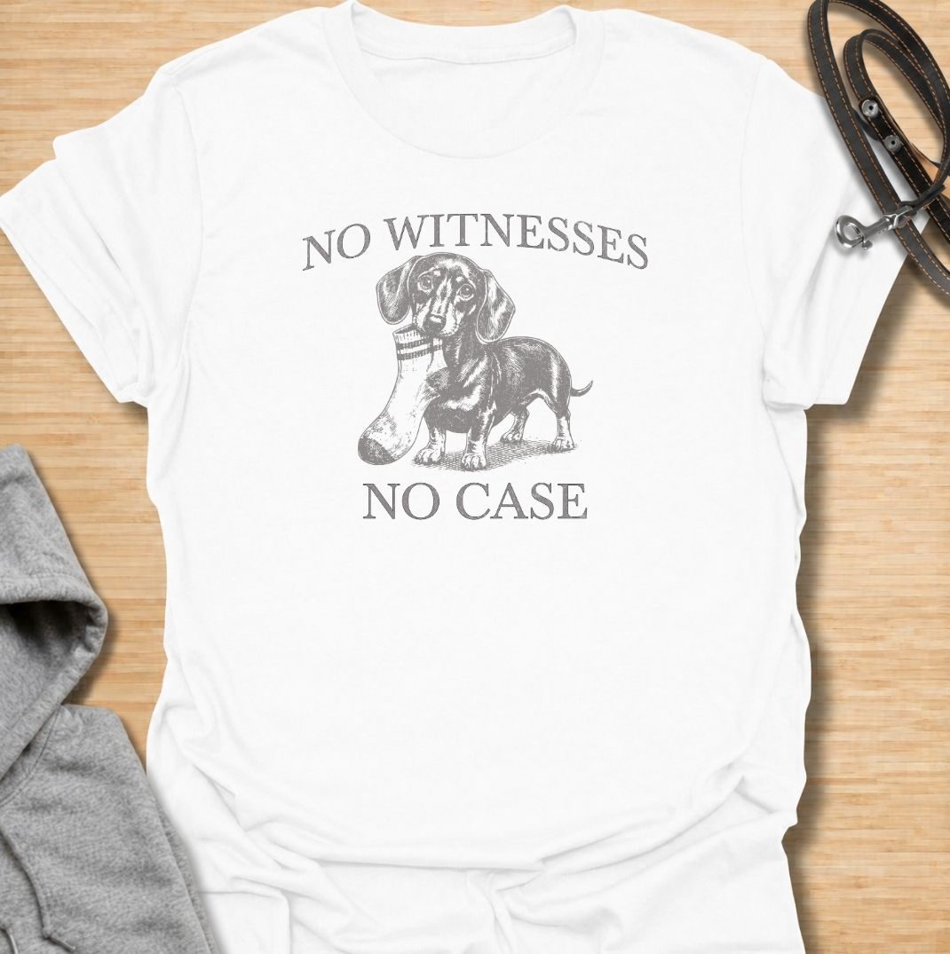 A funny dachshund T-shirt for owners who know their little dog is capable of suspicious behavior. The vintage-style dachshund graphic and “No Witnesses, No Case” phrase give this design a dry, mischievous sense of humor without feeling overly cute. Perfect for dachshund moms, dachshund dads, sausage dog lovers, and anyone familiar with the breed’s stubborn personality. An easy everyday dog lover tee with a retro look that works especially well for fans of funny dachshund shirts and wiener dog humor.