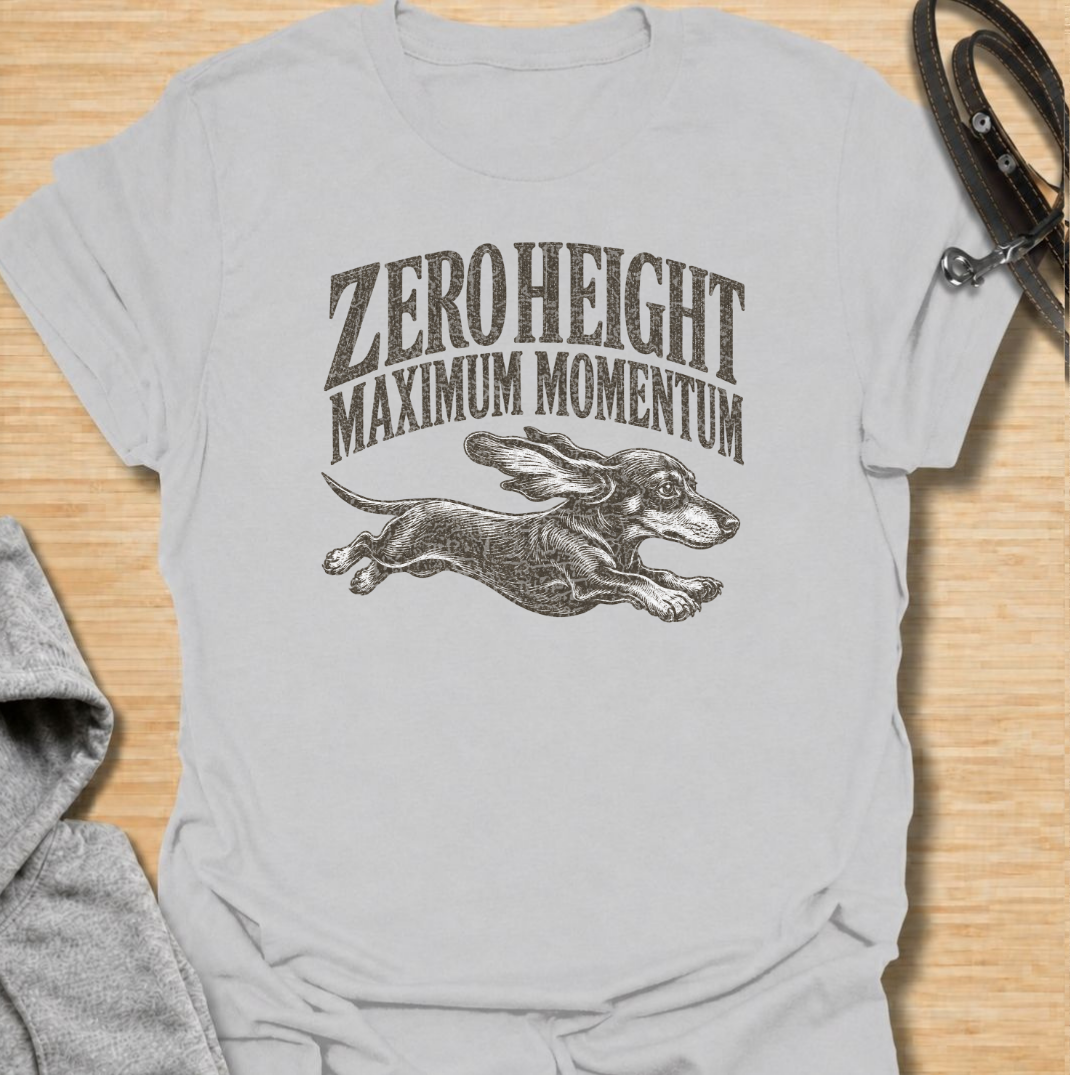 A funny dachshund T-shirt celebrating the surprisingly impressive speed packed into such a low little dog. Featuring the phrase “Zero Height Maximum Momentum” with a running dachshund illustration, this design captures the breed’s energetic and determined personality. Perfect for dachshund moms, dachshund dads, sausage dog owners, and anyone who has seen a dachshund suddenly launch into full-speed mode. A playful vintage-style tee for fans of dachshund humor, wiener dogs, and small dogs with very big energy
