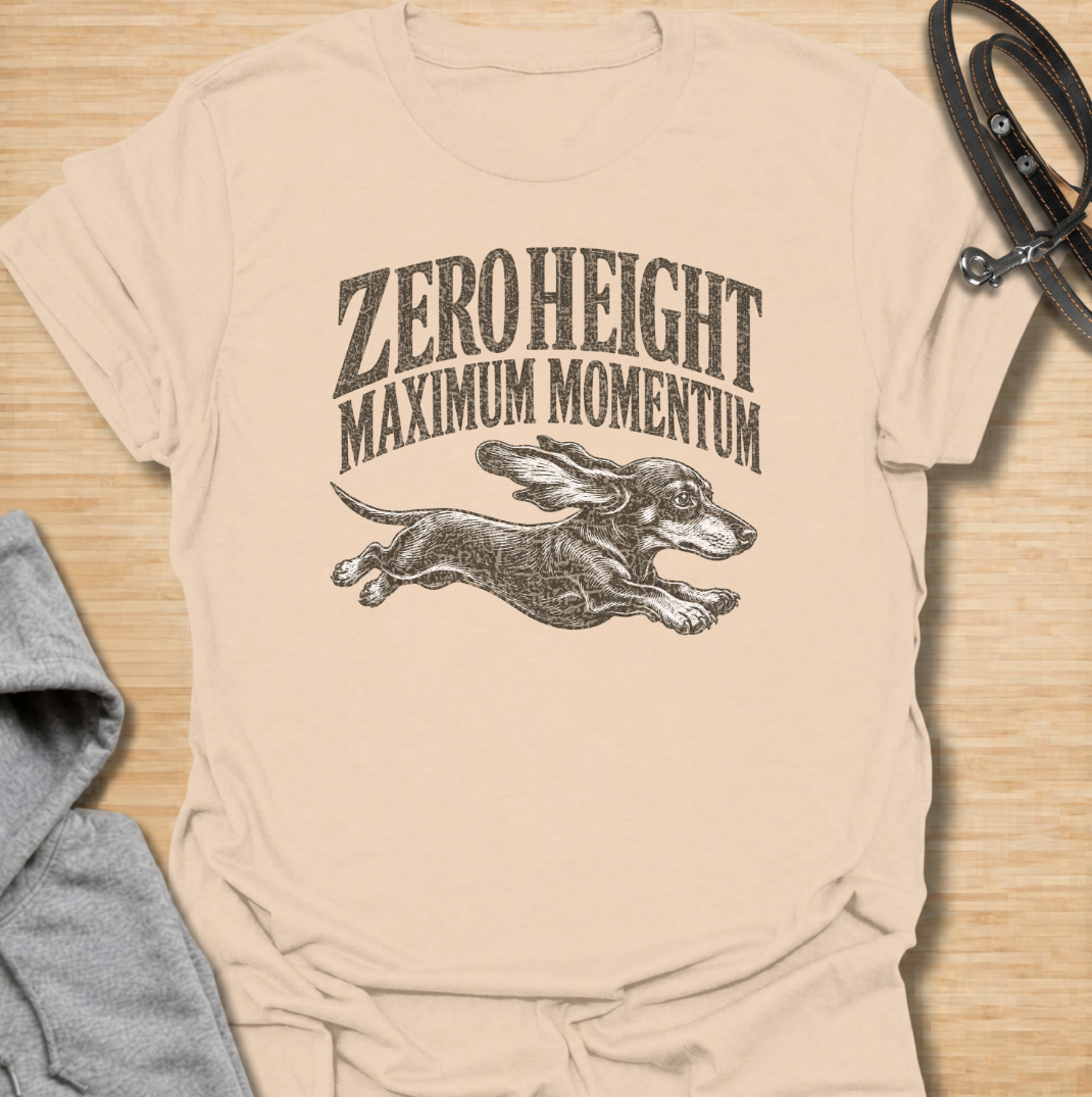 A funny dachshund T-shirt celebrating the surprisingly impressive speed packed into such a low little dog. Featuring the phrase “Zero Height Maximum Momentum” with a running dachshund illustration, this design captures the breed’s energetic and determined personality. Perfect for dachshund moms, dachshund dads, sausage dog owners, and anyone who has seen a dachshund suddenly launch into full-speed mode. A playful vintage-style tee for fans of dachshund humor, wiener dogs, and small dogs with very big energy