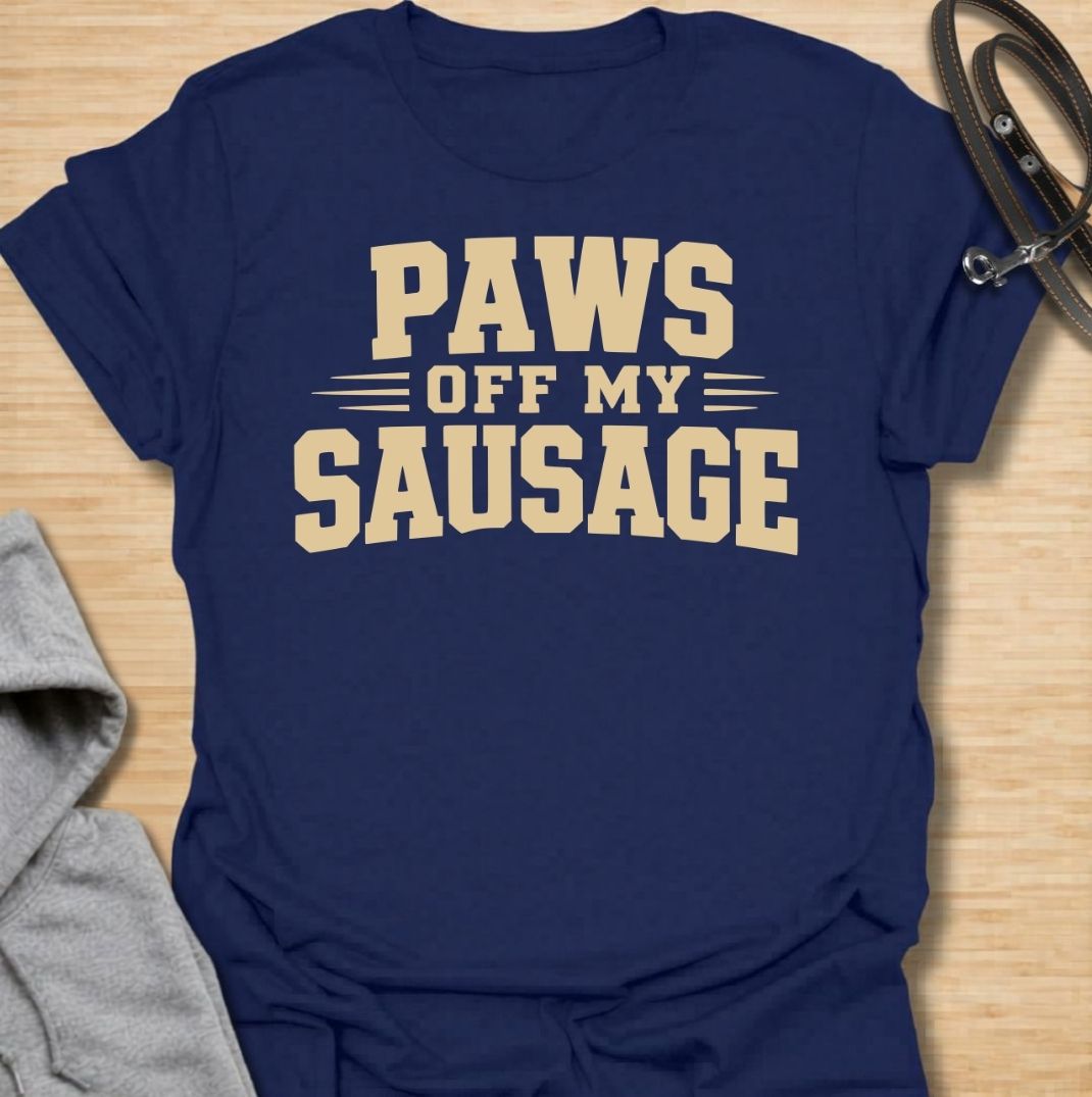 A funny dachshund T-shirt for anyone who takes sausage dog ownership very seriously. Featuring the phrase “Paws Off My Sausage” in bold vintage-inspired lettering, this design delivers a playful double meaning that dachshund lovers will instantly understand. Perfect for dachshund moms, dachshund dads, wiener dog owners, and anyone protective of their favorite little sausage dog. A simple, punchy everyday tee with plenty of dachshund humor and personality.