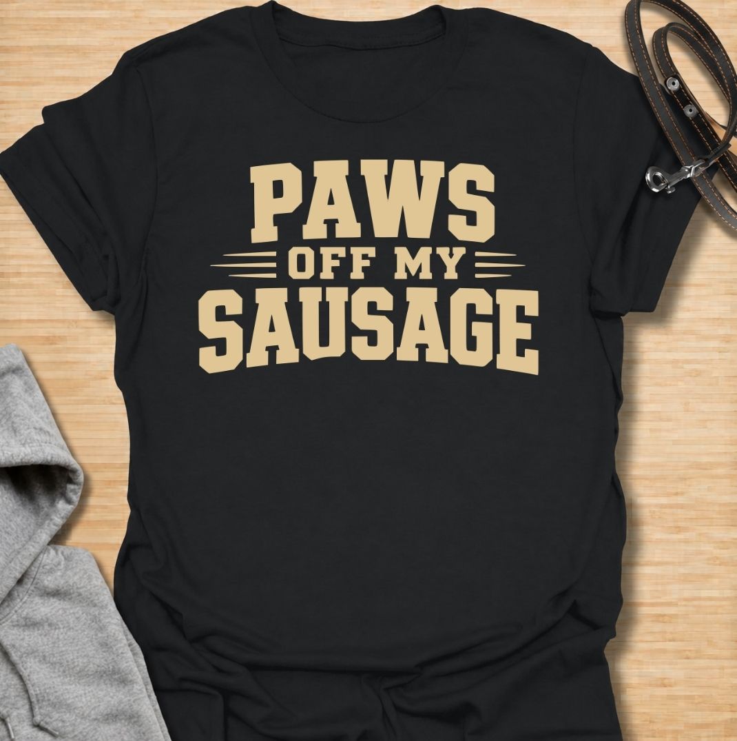 A funny dachshund T-shirt for anyone who takes sausage dog ownership very seriously. Featuring the phrase “Paws Off My Sausage” in bold vintage-inspired lettering, this design delivers a playful double meaning that dachshund lovers will instantly understand. Perfect for dachshund moms, dachshund dads, wiener dog owners, and anyone protective of their favorite little sausage dog. A simple, punchy everyday tee with plenty of dachshund humor and personality.