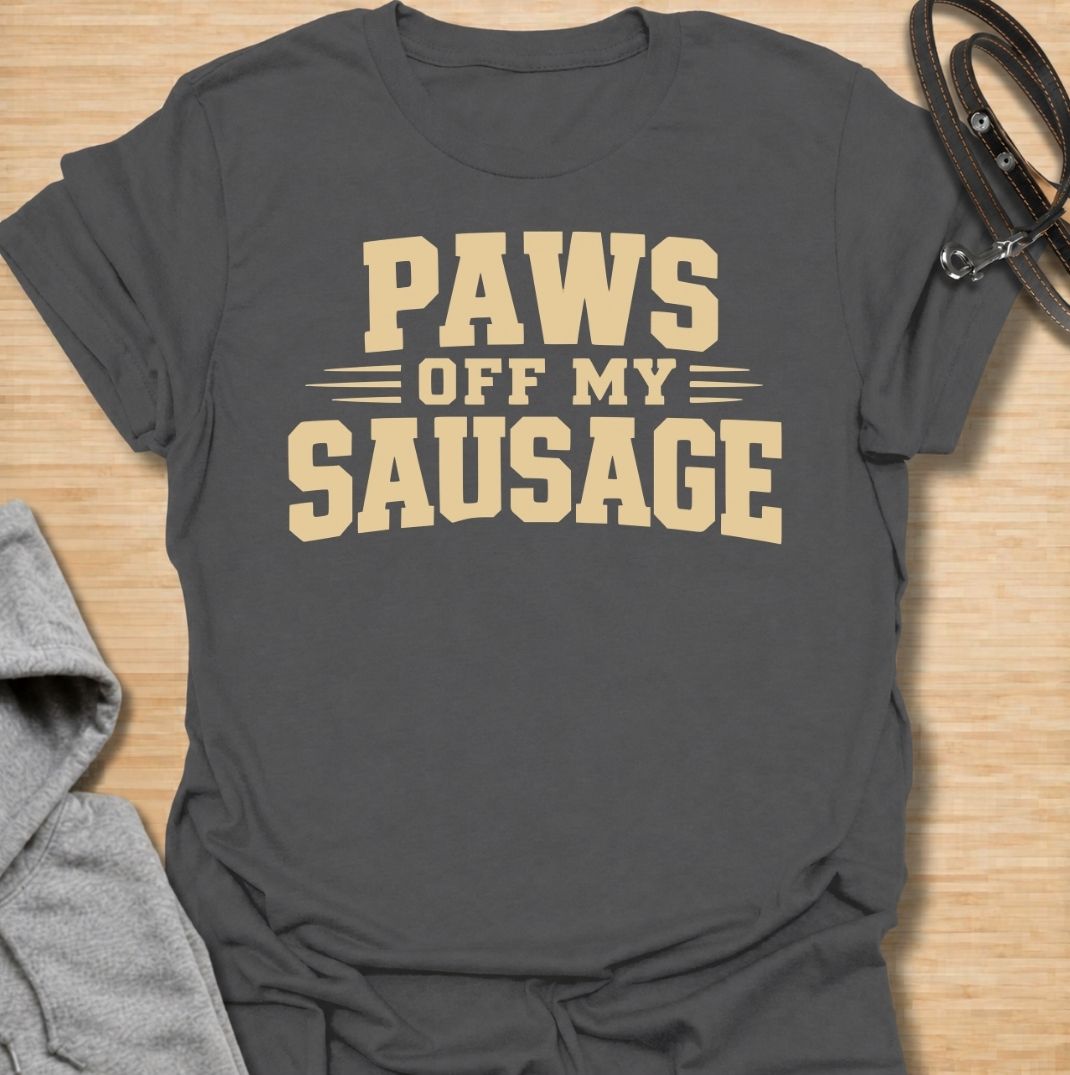 A funny dachshund T-shirt for anyone who takes sausage dog ownership very seriously. Featuring the phrase “Paws Off My Sausage” in bold vintage-inspired lettering, this design delivers a playful double meaning that dachshund lovers will instantly understand. Perfect for dachshund moms, dachshund dads, wiener dog owners, and anyone protective of their favorite little sausage dog. A simple, punchy everyday tee with plenty of dachshund humor and personality.