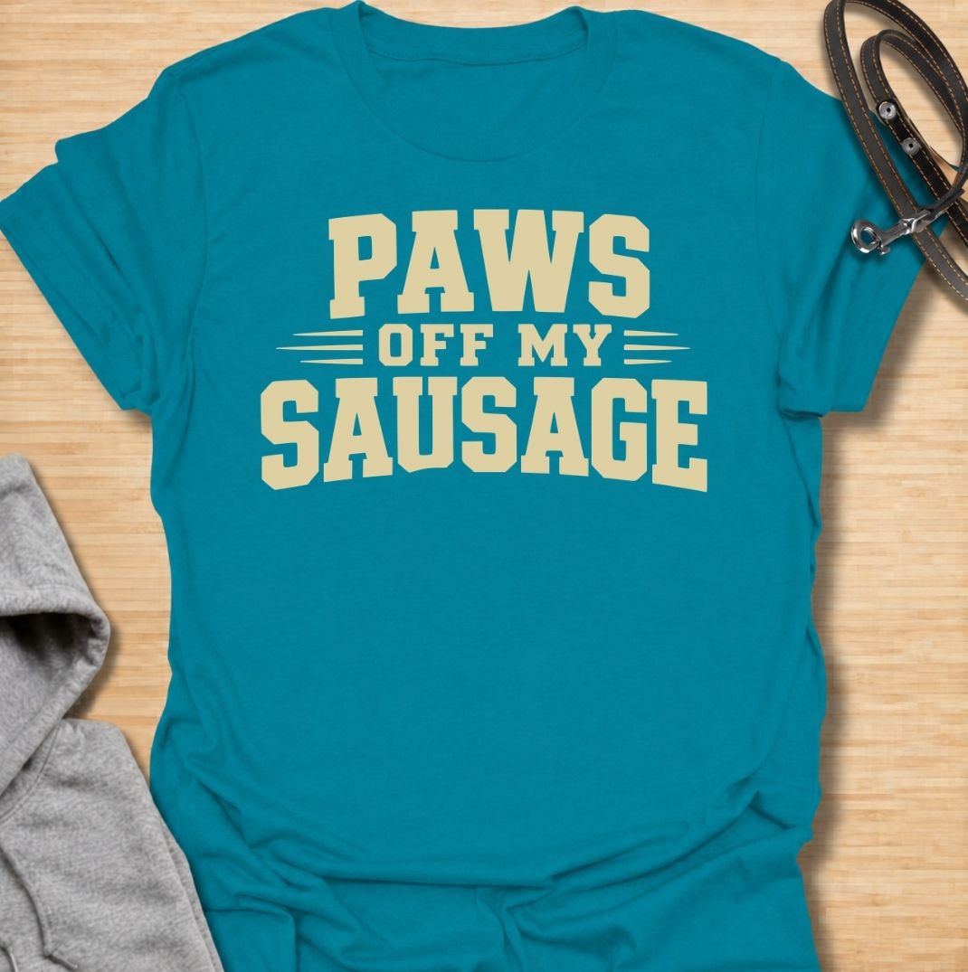 A funny dachshund T-shirt for anyone who takes sausage dog ownership very seriously. Featuring the phrase “Paws Off My Sausage” in bold vintage-inspired lettering, this design delivers a playful double meaning that dachshund lovers will instantly understand. Perfect for dachshund moms, dachshund dads, wiener dog owners, and anyone protective of their favorite little sausage dog. A simple, punchy everyday tee with plenty of dachshund humor and personality.