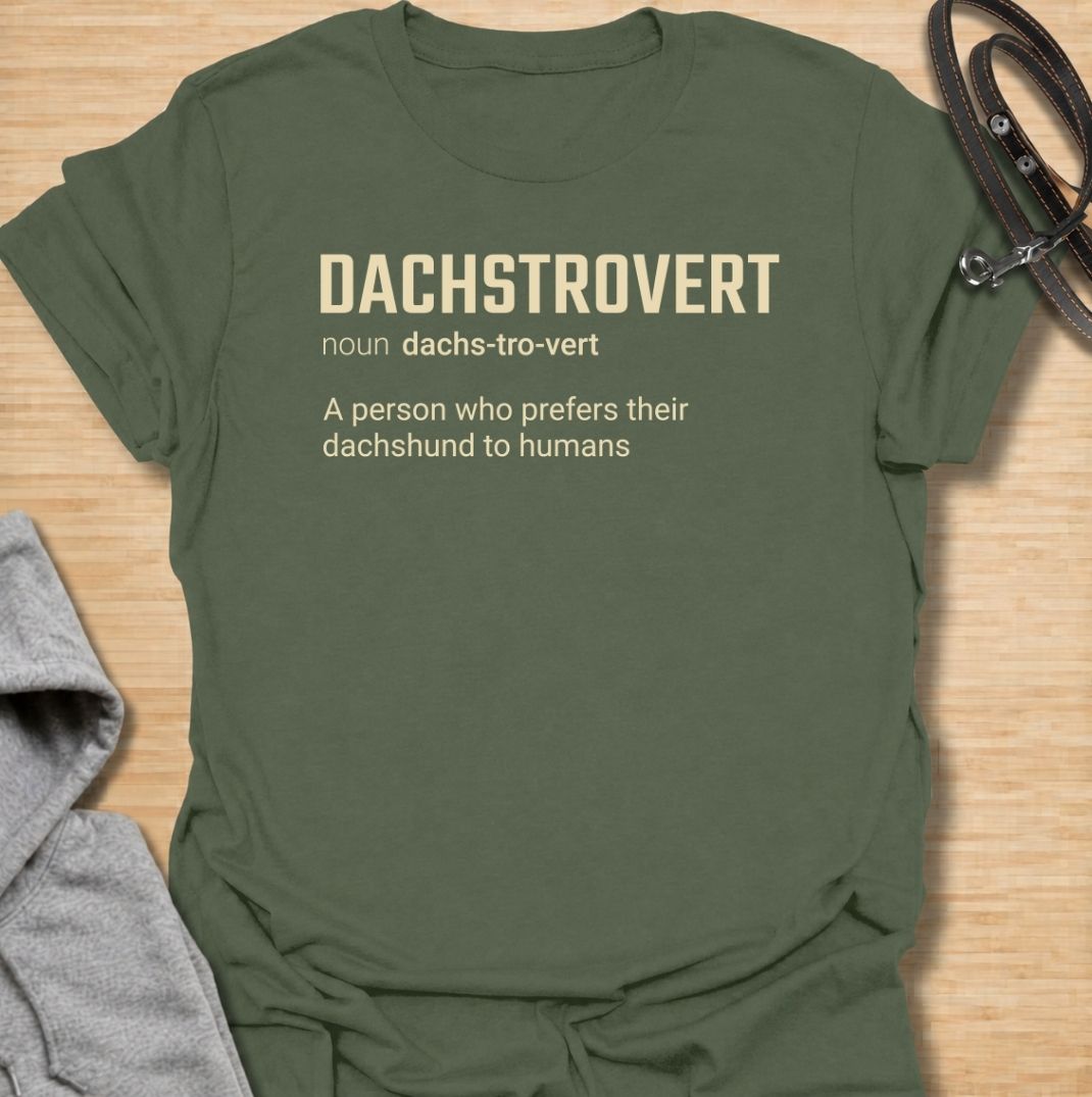 A funny dachshund T-shirt for anyone who would rather spend time with their dog than make small talk with people. Featuring the invented definition “Dachstrovert — A person who prefers their dachshund to humans,” this design has a clean dictionary-style layout with dry, relatable humor. Perfect for dachshund moms, dachshund dads, introverts, sausage dog lovers, and anyone whose favorite company has four short legs. A simple everyday tee for fans of dachshund humor, funny dog sayings, and breed-specific gift