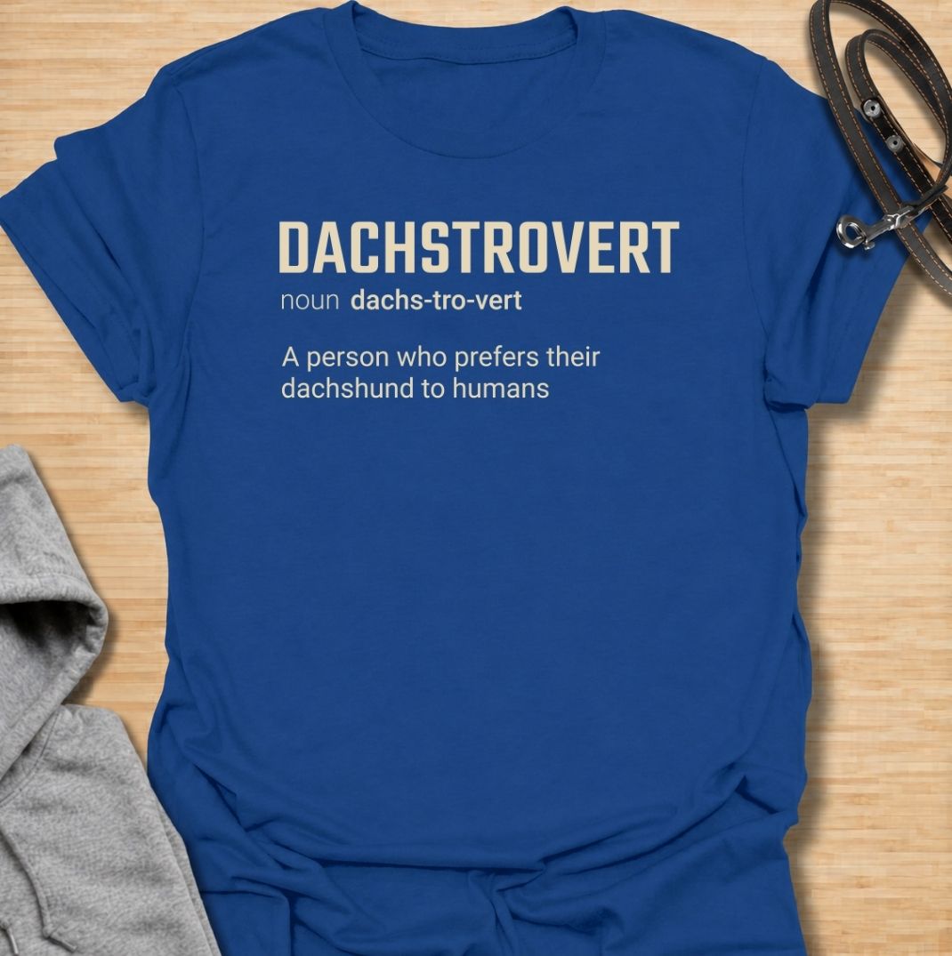 A funny dachshund T-shirt for anyone who would rather spend time with their dog than make small talk with people. Featuring the invented definition “Dachstrovert — A person who prefers their dachshund to humans,” this design has a clean dictionary-style layout with dry, relatable humor. Perfect for dachshund moms, dachshund dads, introverts, sausage dog lovers, and anyone whose favorite company has four short legs. A simple everyday tee for fans of dachshund humor, funny dog sayings, and breed-specific gift