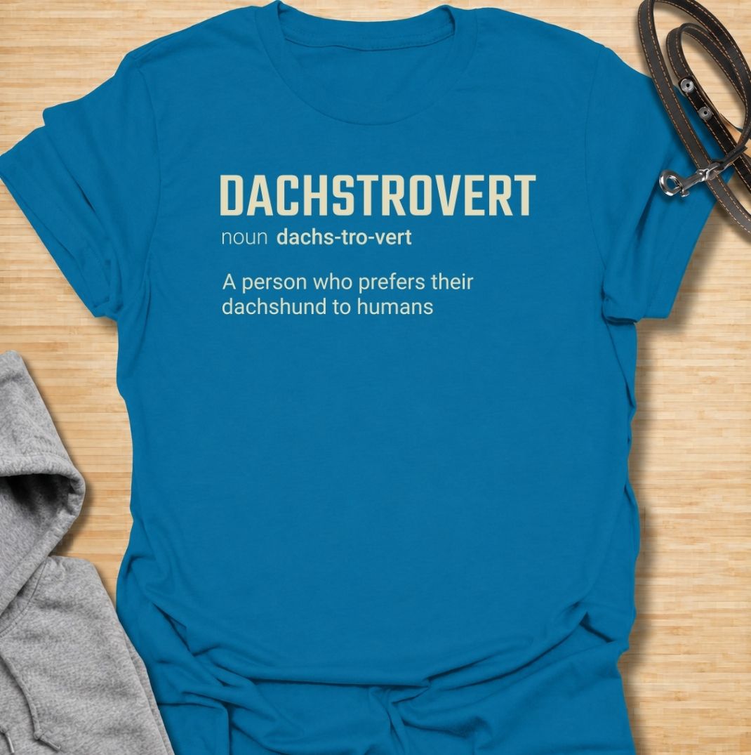 A funny dachshund T-shirt for anyone who would rather spend time with their dog than make small talk with people. Featuring the invented definition “Dachstrovert — A person who prefers their dachshund to humans,” this design has a clean dictionary-style layout with dry, relatable humor. Perfect for dachshund moms, dachshund dads, introverts, sausage dog lovers, and anyone whose favorite company has four short legs. A simple everyday tee for fans of dachshund humor, funny dog sayings, and breed-specific gift