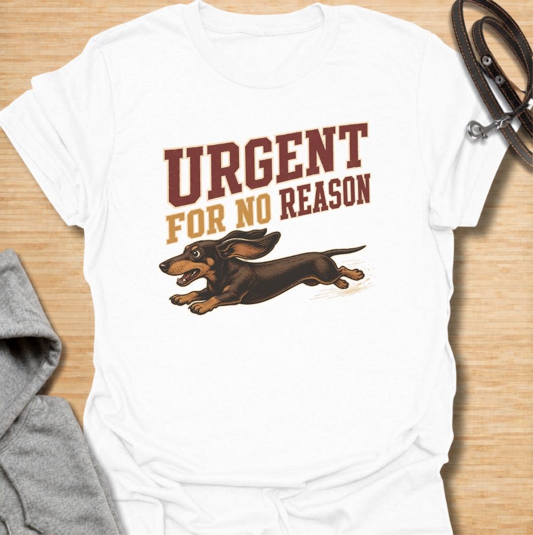 A funny dachshund T-shirt for anyone familiar with the sudden bursts of speed that seem to come from absolutely nowhere. Featuring the phrase “Urgent For No Reason” with a running dachshund illustration, this design captures the breed’s energetic, dramatic personality perfectly. Ideal for dachshund moms, dachshund dads, sausage dog owners, and anyone who has witnessed an unexpected dachshund sprint across the house or yard. A playful everyday tee for fans of dachshund humor, wiener dog chaos, and small dogs