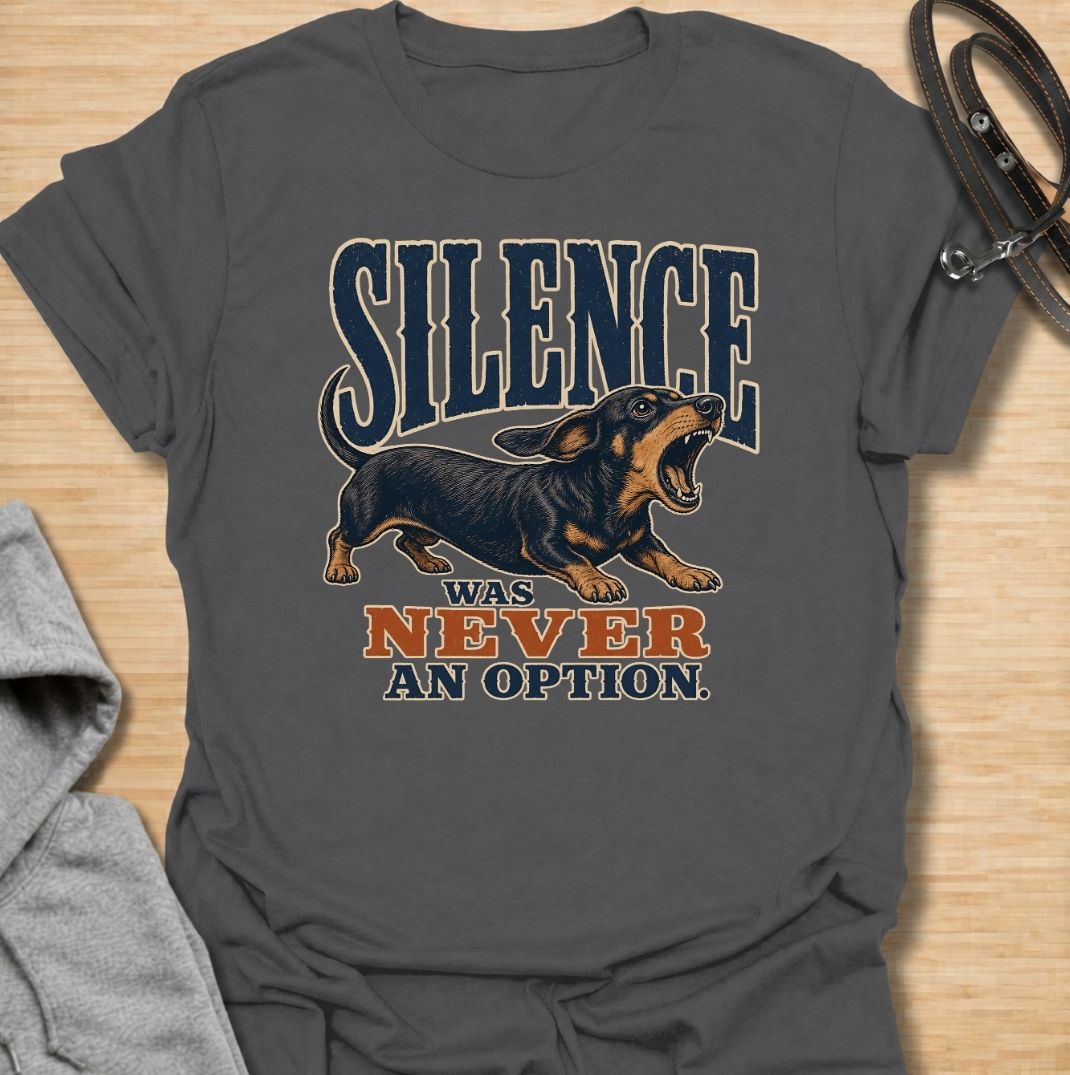 A funny dachshund T-shirt for anyone who knows silence is rarely part of life with a sausage dog. Featuring the phrase “Silence Was Never an Option” with a barking dachshund illustration, this design captures the breed’s loud, opinionated personality perfectly. Ideal for dachshund moms, dachshund dads, wiener dog owners, and anyone whose little dog always has something to say. A bold everyday tee for fans of dachshund humor, noisy dogs, and small dogs with very big voices.