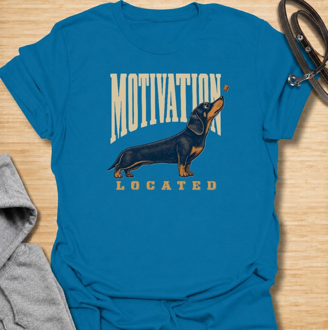 A funny dachshund T-shirt for anyone who knows exactly what gets a sausage dog moving. Featuring the phrase “Motivation Located” with a dachshund focused firmly on a treat, this design captures the breed’s famously food-driven personality. Perfect for dachshund moms, dachshund dads, wiener dog owners, and anyone familiar with just how effective snacks can be. A playful everyday tee for fans of dachshund humor, treat-obsessed dogs, and small dogs with very clear priorities.