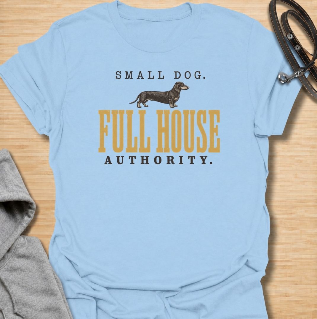 A funny dachshund T-shirt for anyone who knows a small dog can somehow run the entire household. Featuring the phrase “Small Dog. Full House Authority.” with a simple dachshund illustration, this design captures the breed’s confident, bossy personality in a clean vintage-inspired style. Perfect for dachshund moms, dachshund dads, sausage dog owners, and anyone whose little dog acts like the head of the house. A playful everyday tee for fans of dachshund humor, wiener dogs, and small dogs with very big opini