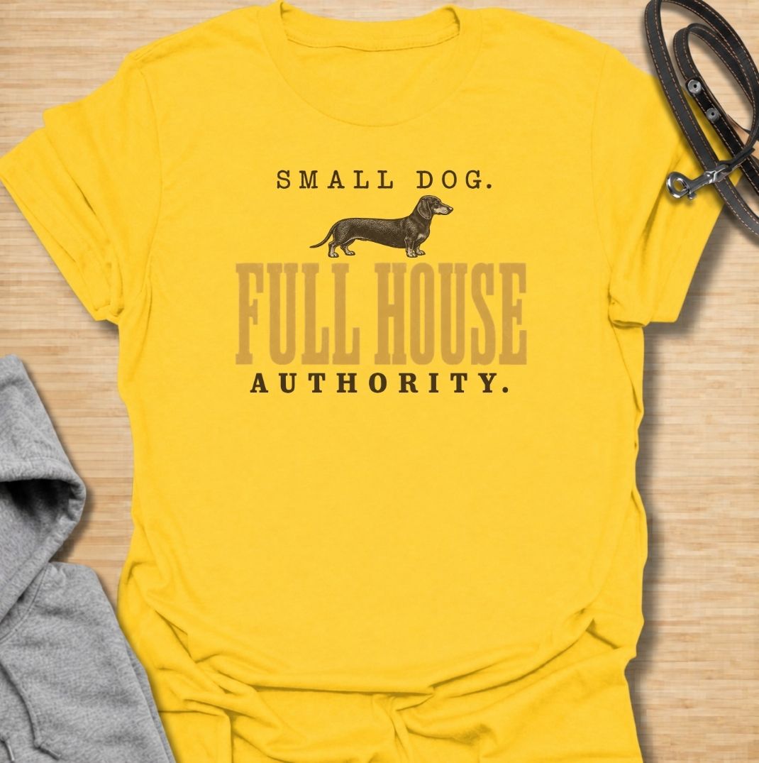 A funny dachshund T-shirt for anyone who knows a small dog can somehow run the entire household. Featuring the phrase “Small Dog. Full House Authority.” with a simple dachshund illustration, this design captures the breed’s confident, bossy personality in a clean vintage-inspired style. Perfect for dachshund moms, dachshund dads, sausage dog owners, and anyone whose little dog acts like the head of the house. A playful everyday tee for fans of dachshund humor, wiener dogs, and small dogs with very big opini