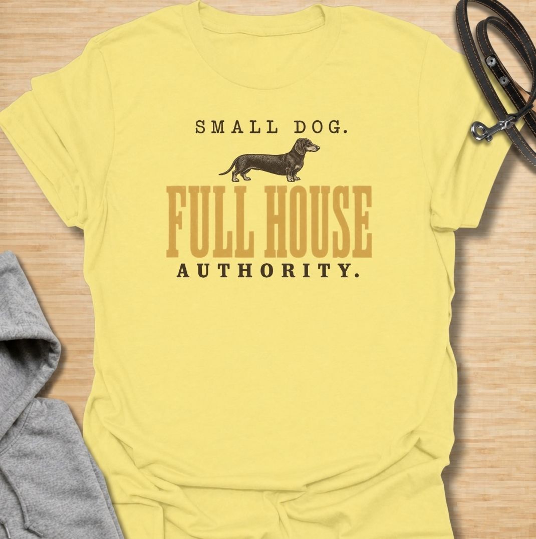 A funny dachshund T-shirt for anyone who knows a small dog can somehow run the entire household. Featuring the phrase “Small Dog. Full House Authority.” with a simple dachshund illustration, this design captures the breed’s confident, bossy personality in a clean vintage-inspired style. Perfect for dachshund moms, dachshund dads, sausage dog owners, and anyone whose little dog acts like the head of the house. A playful everyday tee for fans of dachshund humor, wiener dogs, and small dogs with very big opini