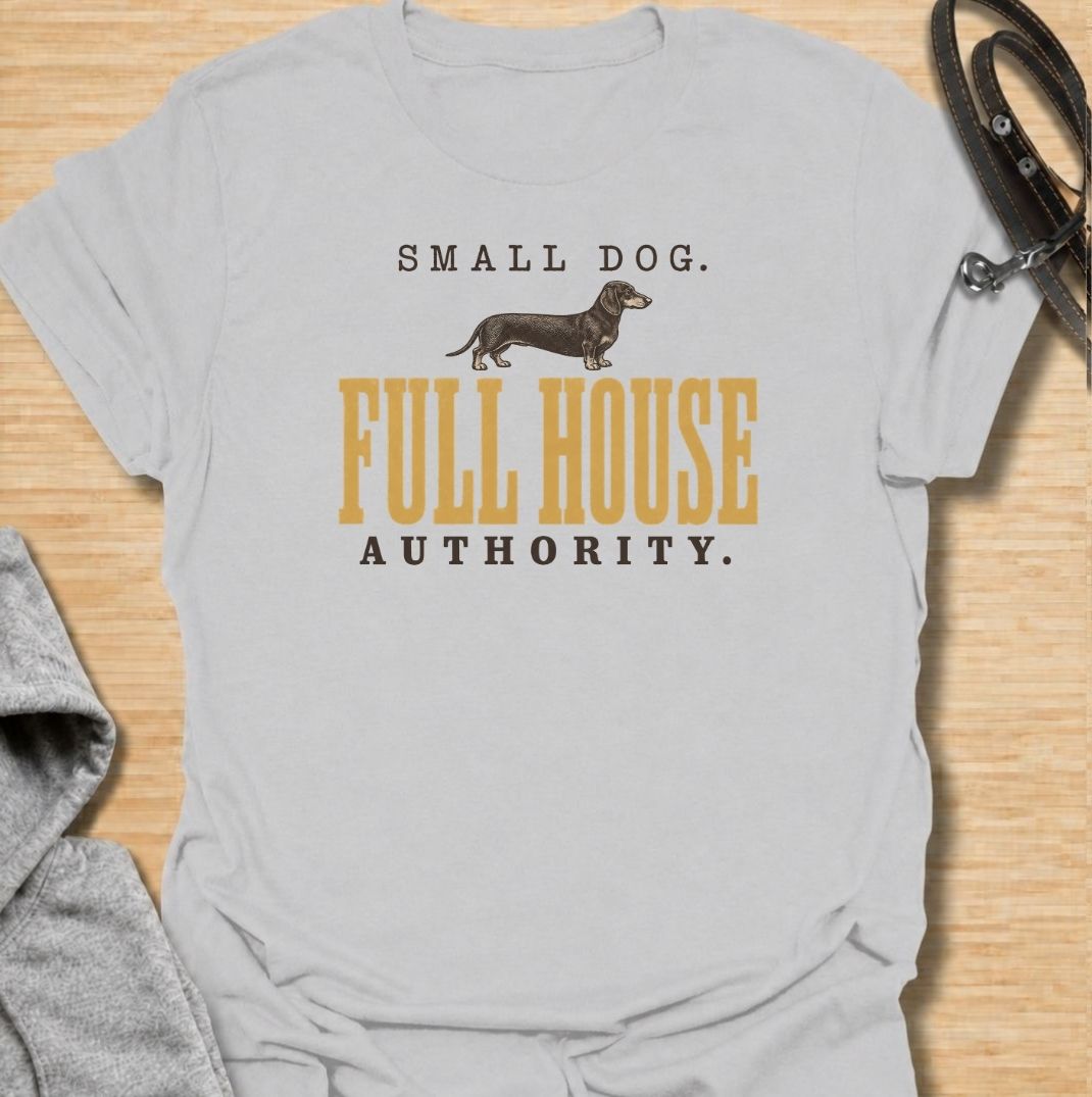 A funny dachshund T-shirt for anyone who knows a small dog can somehow run the entire household. Featuring the phrase “Small Dog. Full House Authority.” with a simple dachshund illustration, this design captures the breed’s confident, bossy personality in a clean vintage-inspired style. Perfect for dachshund moms, dachshund dads, sausage dog owners, and anyone whose little dog acts like the head of the house. A playful everyday tee for fans of dachshund humor, wiener dogs, and small dogs with very big opini