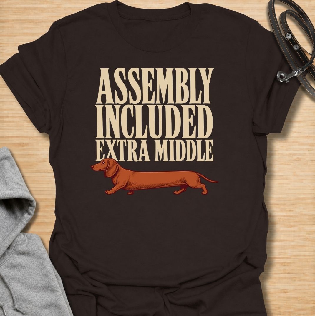 A funny dachshund T-shirt for anyone who knows these little dogs seem to have been built with a little too much middle. Featuring the phrase “Assembly Included Extra Middle” with a long dachshund illustration, this design turns the breed’s unmistakable shape into a dry, clever joke. Perfect for dachshund moms, dachshund dads, sausage dog owners, and anyone who loves breed-specific humor. A playful everyday tee for fans of dachshunds, wiener dogs, and funny dog gifts with a vintage feel.