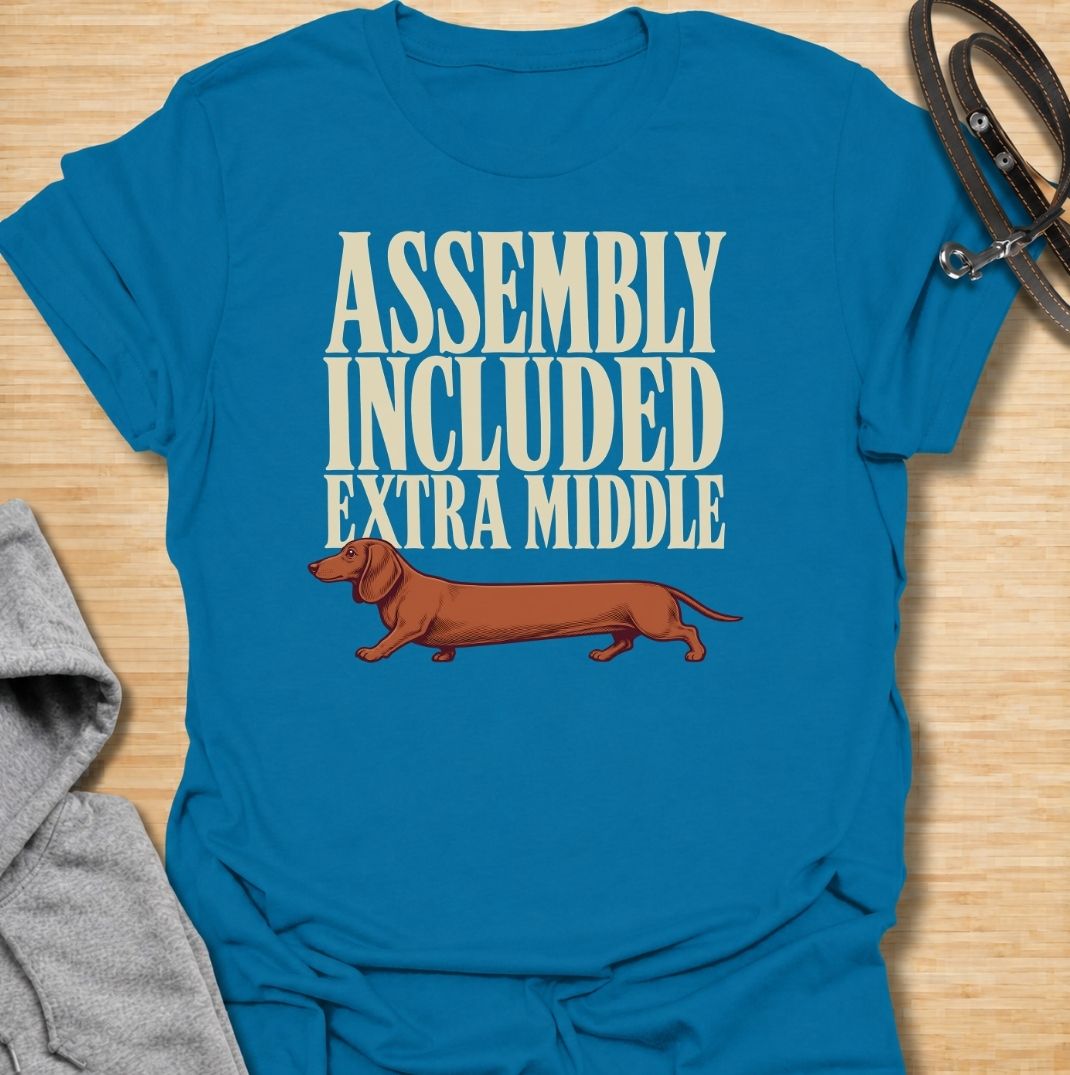 A funny dachshund T-shirt for anyone who knows these little dogs seem to have been built with a little too much middle. Featuring the phrase “Assembly Included Extra Middle” with a long dachshund illustration, this design turns the breed’s unmistakable shape into a dry, clever joke. Perfect for dachshund moms, dachshund dads, sausage dog owners, and anyone who loves breed-specific humor. A playful everyday tee for fans of dachshunds, wiener dogs, and funny dog gifts with a vintage feel.